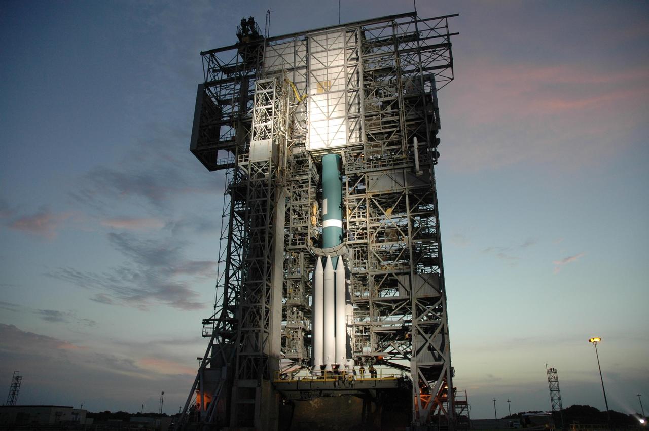 KENNEDY SPACE CENTER, FLA. -- Preparations to move the mobile service tower, or gantry, from around the Delta II 7925 rocket are under way under the lights on Launch Pad 17A at Cape Canaveral Air Force Station. Equipped with three stages and nine strap-on solid rocket motors, the Delta II rocket packs plenty of punch for sending the Phoenix spacecraft on its way toward Mars. Launch is targeted for Aug. 4 during one of two opportunities for liftoff: 5:26 or 6:02 a.m. EDT. Phoenix will land in icy soils near the north polar, permanent ice cap of Mars and explore the history of the water in these soils and any associated rocks, while monitoring polar climate. Landing on Mars is planned in May 2008 on arctic ground where a mission currently in orbit, Mars Odyssey, has detected high concentrations of ice just beneath the top layer of soil.   Photo credit: NASA/Jim Grossmann