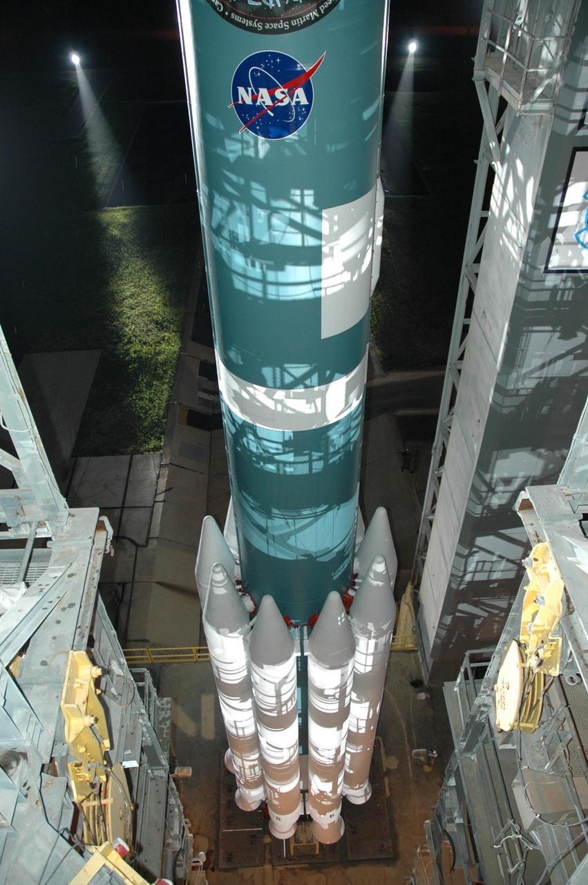 KENNEDY SPACE CENTER, FLA. -- The Delta II 7925 rocket is revealed as the mobile service tower, or gantry, rolls back on Launch Pad 17A at Cape Canaveral Air Force Station.  Equipped with three stages and nine strap-on solid rocket motors, the Delta II rocket packs plenty of punch for sending the Phoenix spacecraft on its way toward Mars. Launch is targeted for Aug. 4 during one of two opportunities for liftoff: 5:26 or 6:02 a.m. EDT. Phoenix will land in icy soils near the north polar, permanent ice cap of Mars and explore the history of the water in these soils and any associated rocks, while monitoring polar climate. Landing on Mars is planned in May 2008 on arctic ground where a mission currently in orbit, Mars Odyssey, has detected high concentrations of ice just beneath the top layer of soil.   Photo credit: NASA/Jim Grossmann