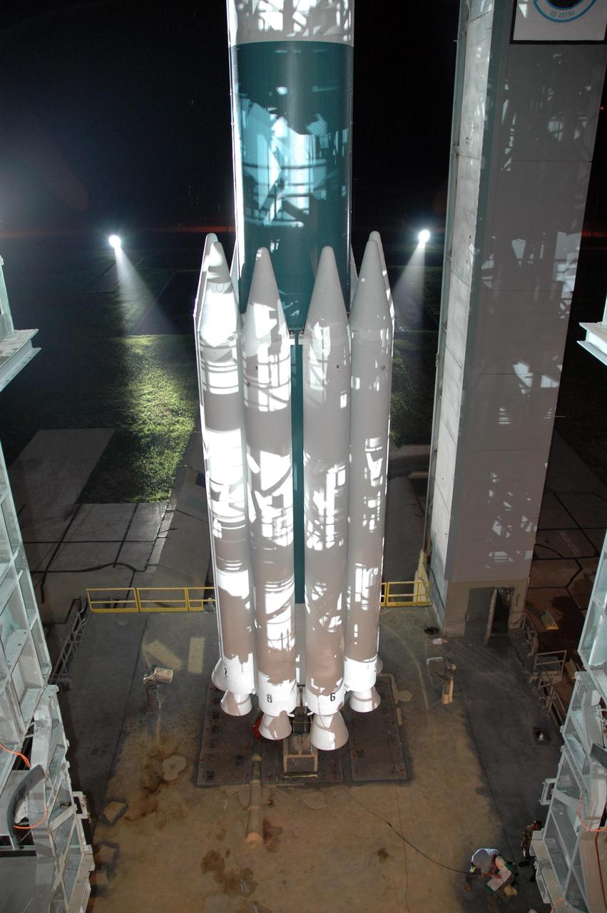 KENNEDY SPACE CENTER, FLA. -- The solid rocket boosters on the Delta II 7925 rocket are revealed following the retraction of the mobile service tower, or gantry, on Launch Pad 17A at Cape Canaveral Air Force Station. Equipped with three stages and nine strap-on solid rocket motors, the Delta II rocket packs plenty of punch for sending the Phoenix spacecraft on its way toward Mars. Launch is targeted for Aug. 4 during one of two opportunities for liftoff: 5:26 or 6:02 a.m. EDT. Phoenix will land in icy soils near the north polar, permanent ice cap of Mars and explore the history of the water in these soils and any associated rocks, while monitoring polar climate. Landing on Mars is planned in May 2008 on arctic ground where a mission currently in orbit, Mars Odyssey, has detected high concentrations of ice just beneath the top layer of soil. Photo credit: NASA/Jim Grossmann