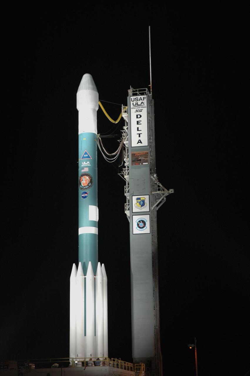 KENNEDY SPACE CENTER, FLA. -- Rollback of the mobile service tower, or gantry, from around the Delta II 7925 rocket is complete on Launch Pad 17A at Cape Canaveral Air Force Station.  Equipped with three stages and nine strap-on solid rocket motors, the Delta II rocket packs plenty of punch for sending the Phoenix spacecraft on its way toward Mars. Launch is targeted for Aug. 4 during one of two opportunities for liftoff: 5:26 or 6:02 a.m. EDT. Phoenix will land in icy soils near the north polar, permanent ice cap of Mars and explore the history of the water in these soils and any associated rocks, while monitoring polar climate. Landing on Mars is planned in May 2008 on arctic ground where a mission currently in orbit, Mars Odyssey, has detected high concentrations of ice just beneath the top layer of soil.   Photo credit: NASA/Jim Grossmann