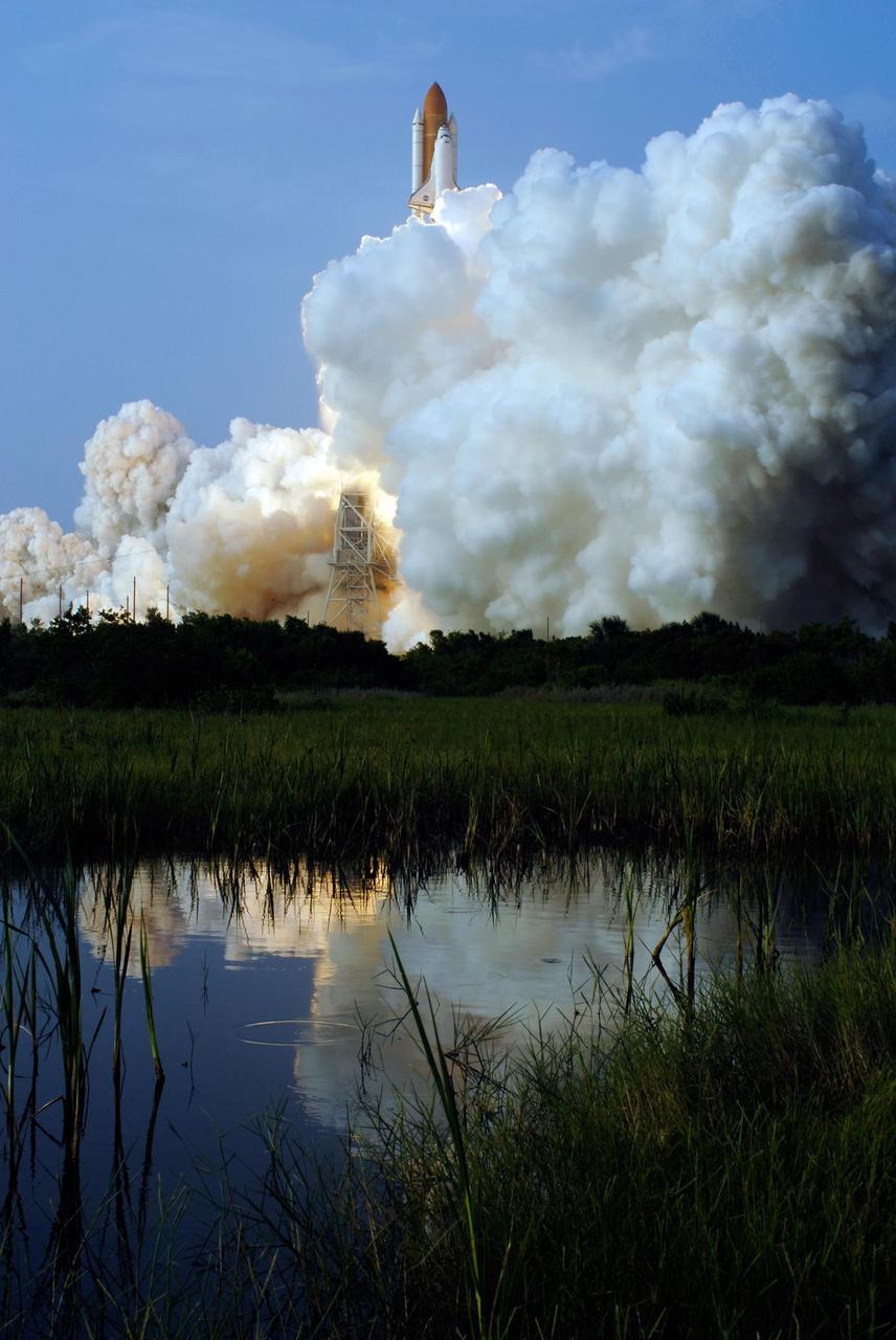 KENNEDY SPACE CENTER, FLA. --  Clouds of smoke and steam roll across Launch Pad 39A as Space Shuttle Endeavour leaps free above them, beginning its journey on mission STS-118.  Liftoff of Endeavour was on time at 6:36 p.m. EDT. The mission is the 22nd shuttle flight to the International Space Station. It will continue space station construction by delivering a third starboard truss segment, S5, and other payloads such as the SPACEHAB module and the external stowage platform 3.  The 11-day mission may be extended to as many as 14 depending on the test of the Station-to-Shuttle Power Transfer System that will allow the docked shuttle to draw electrical power from the station and extend its visits to the orbiting lab.  Photo credit: NASA/Sandra Joseph, Tony Gray, Robert Murray