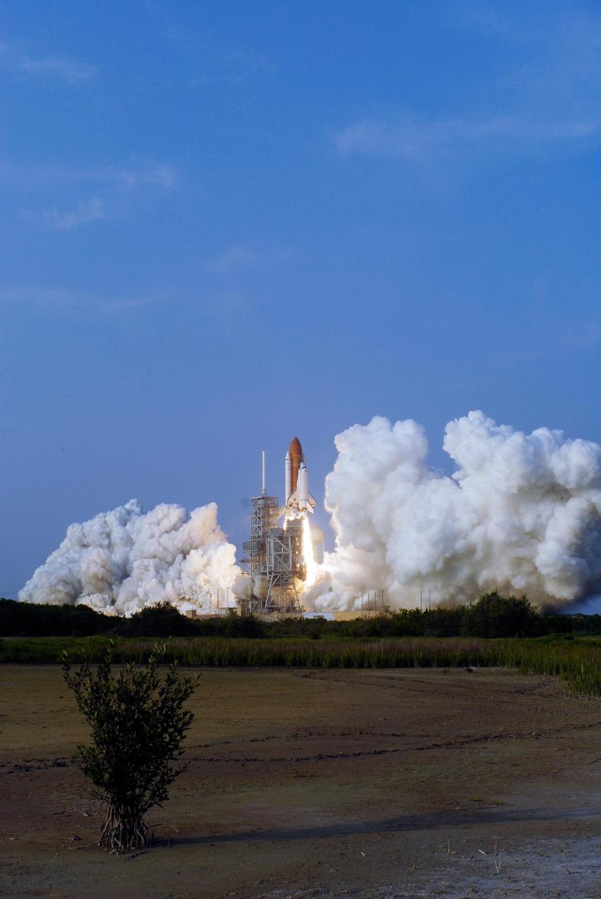 KENNEDY SPACE CENTER, FLA. --  As billows of smoke spread across Launch Pad 39A, Space Shuttle Endeavour climbs into the sky on mission STS-118. Liftoff was on time at 6:36 p.m. EDT.  The mission is the 22nd shuttle flight to the International Space Station. It will continue space station construction by delivering a third starboard truss segment, S5, and other payloads such as the SPACEHAB module and the external stowage platform 3.  The 11-day mission may be extended to as many as 14 depending on the test of the Station-to-Shuttle Power Transfer System that will allow the docked shuttle to draw electrical power from the station and extend its visits to the orbiting lab.  Photo credit: NASA/Sandra Joseph, Tony Gray, Robert Murray