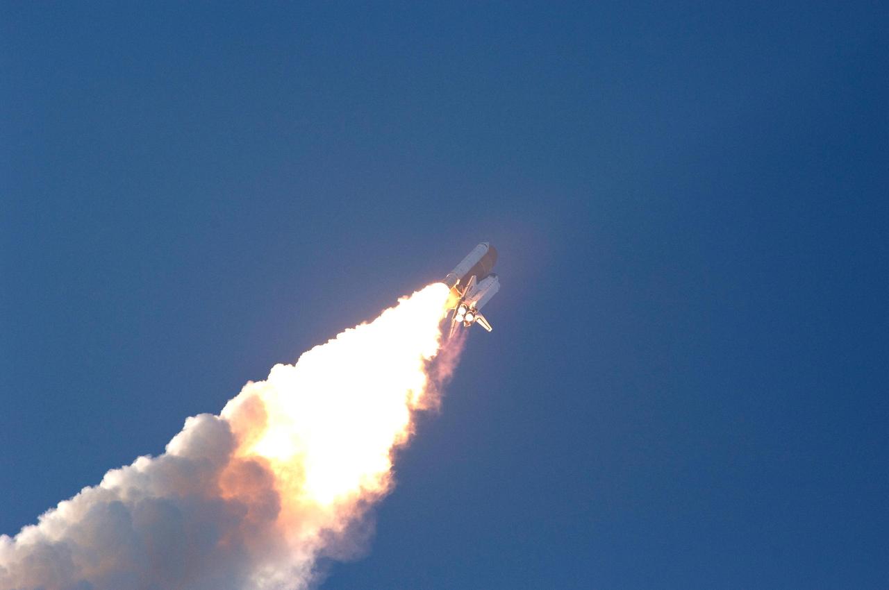 KENNEDY SPACE CENTER, FLA. --  Spewing smoke from the solid rocket boosters, Space Shuttle Endeavour roars into the sky on mission STS-118.   The liftoff from Launch Pad 39A was on time at 6:36 p.m. EDT.  The mission is the 22nd shuttle flight to the International Space Station. It will continue space station construction by delivering a third starboard truss segment, S5, and other payloads such as the SPACEHAB module and the external stowage platform 3.  The 11-day mission may be extended to as many as 14 depending on the test of the Station-to-Shuttle Power Transfer System that will allow the docked shuttle to draw electrical power from the station and extend its visits to the orbiting lab.  Photo credit: NASA/Jerry Cannon, Mike Kerley
