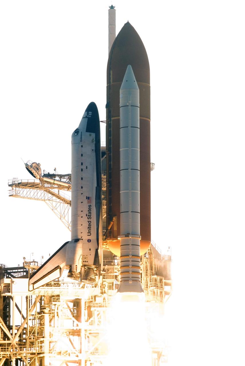 KENNEDY SPACE CENTER, FLA. --  Fiery clouds of smoke stream across Launch Pad 39A as Space Shuttle Endeavour lifts off on mission STS-118.  The liftoff was on time at 6:36 p.m. EDT.  The mission is the 22nd shuttle flight to the International Space Station. It will continue space station construction by delivering a third starboard truss segment, S5, and other payloads such as the SPACEHAB module and the external stowage platform 3.  The 11-day mission may be extended to as many as 14 depending on the test of the Station-to-Shuttle Power Transfer System that will allow the docked shuttle to draw electrical power from the station and extend its visits to the orbiting lab.  Photo credit: Jerry Cannon, Mike Kerley