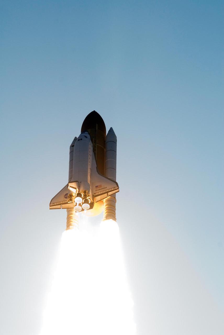 KENNEDY SPACE CENTER, FLA. --  Space Shuttle Endeavour races into the sky trailing columns of fire from the solid rocket boosters as it begins mission STS-118. The liftoff from Launch Pad 39A was on time at 6:36 p.m. EDT.  The mission is the 22nd shuttle flight to the International Space Station. It will continue space station construction by delivering a third starboard truss segment, S5, and other payloads such as the SPACEHAB module and the external stowage platform 3.  The 11-day mission may be extended to as many as 14 depending on the test of the Station-to-Shuttle Power Transfer System that will allow the docked shuttle to draw electrical power from the station and extend its visits to the orbiting lab.  Photo credit: NASA/Jerry Cannon, Mike Kerley