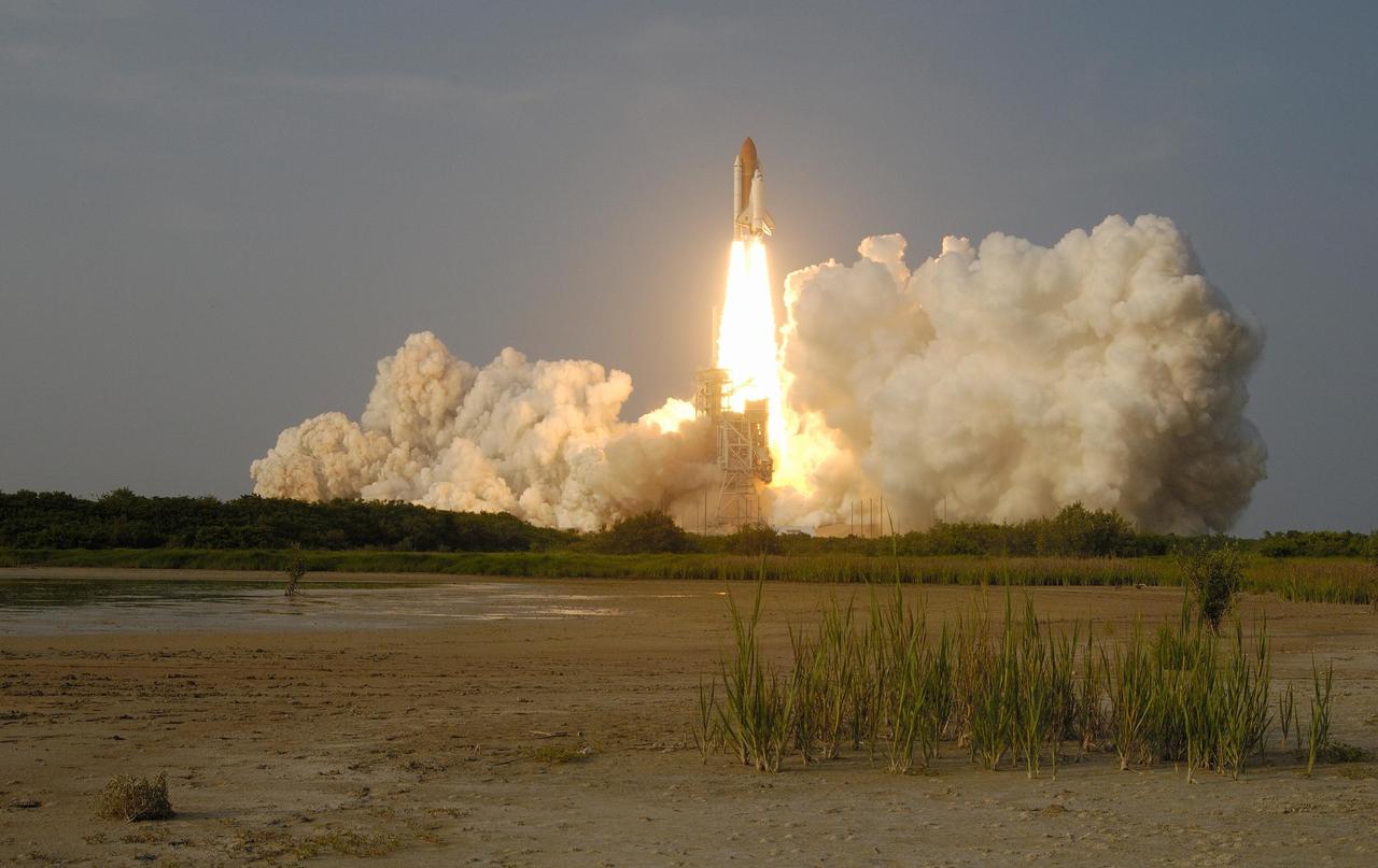 KENNEDY SPACE CENTER, FLA. -- Space Shuttle Endeavour leaps free from the clouds of smoke and steam across Launch Pad 39A after liftoff on mission STS-118.  The liftoff was on time at 6:36 p.m. EDT.  The mission is the 22nd shuttle flight to the International Space Station. It will continue space station construction by delivering a third starboard truss segment, S5, and other payloads such as the SPACEHAB module and the external stowage platform 3.  The 11-day mission may be extended to as many as 14 depending on the test of the Station-to-Shuttle Power Transfer System that will allow the docked shuttle to draw electrical power from the station and extend its visits to the orbiting lab.  Photo courtesy of Nikon/Scott Andrews