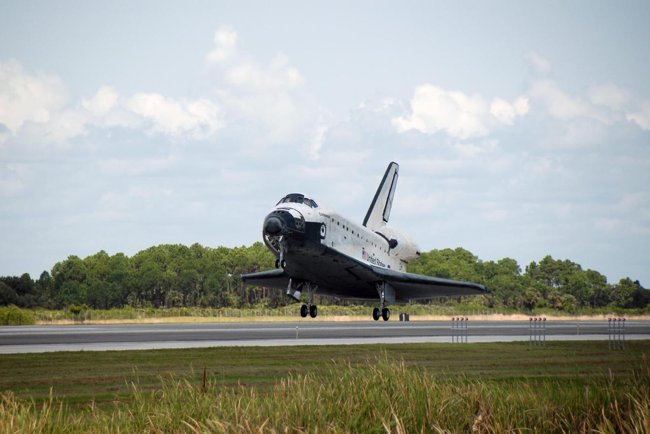 KENNEDY SPACE CENTER, FLA. -- Endeavour approaches touchdown on runway 15 at NASA's Kennedy Space Center. The Space Shuttle Endeavour crew, led by Commander Scott Kelly, completes a 13-day mission to the International Space Station. The STS-118 mission began Aug. 8 and installed a new gyroscope, an external spare parts platform and another truss segment to the expanding station. Endeavour's main gear touched down at 12:32:16 p.m. EDT. Nose gear touchdown was at 12:32:29 p.m. and wheel stop was at 12:33:20 p.m. Endeavour traveled nearly 5.3 million miles, landing on orbit 201. STS-118 was the 119th space shuttle flight, the 22nd flight to the station, the 20th flight for Endeavour and the second of four missions planned for 2007. This was the 65th landing of an orbiter at Kennedy. Photo credit: NASA/Kim Shiflett