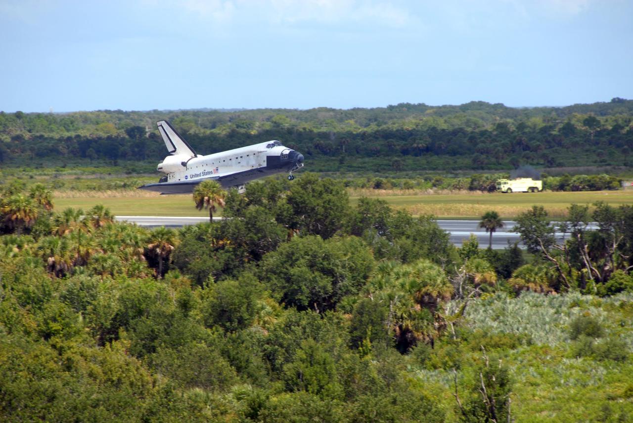 KENNEDY SPACE CENTER, FLA. --  Endeavour glides over runway 15 at as it prepares to land at NASA's Kennedy Space Center. The Space Shuttle Endeavour crew, led by Commander Scott Kelly, completes a 13-day mission to the International Space Station.  The STS-118 mission began Aug. 8 and installed a new gyroscope, an external spare parts platform and another truss segment to the expanding station.  Endeavour's main gear touched down at 12:32:16  p.m. EDT.  Nose gear touchdown was at 12:32:29 p.m. and wheel stop was at 12:33:20 p.m.  Endeavour traveled nearly 5.3 million miles, landing on orbit 201. STS-118 was the 119th space shuttle flight, the 22nd flight to the station, the 20th flight for Endeavour and the second of four missions planned for 2007. This was the 65th landing of an orbiter at Kennedy. Photo credit:  NASA/Ken Thornsley