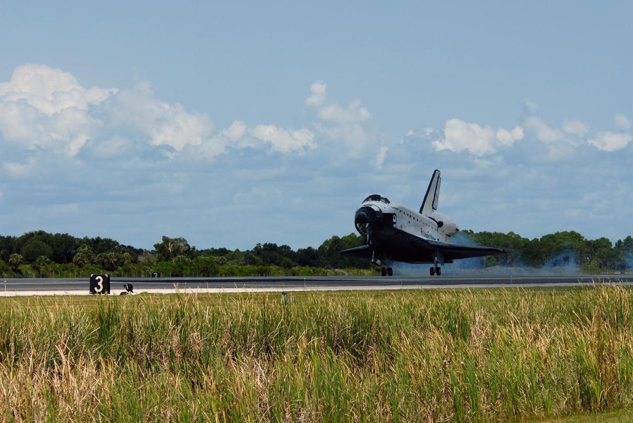 KENNEDY SPACE CENTER, FLA. --  Endeavour stirs the dust as it lands on runway 15 at NASA's Kennedy Space Center as after traveling nearly 5.3 million miles on mission STS-118. The Space Shuttle Endeavour crew, led by Commander Scott Kelly, completes a 13-day mission to the International Space Station.  The STS-118 mission began Aug. 8 and installed a new gyroscope, an external spare parts platform and another truss segment to the expanding station.  Endeavour's main gear touched down at 12:32:16  p.m. EDT.  Nose gear touchdown was at 12:32:29 p.m. and wheel stop was at 12:33:20 p.m.  Endeavour landed on orbit 201. STS-118 was the 119th space shuttle flight, the 22nd flight to the station, the 20th flight for Endeavour and the second of four missions planned for 2007. This was the 65th landing of an orbiter at Kennedy.  Photo credit:  NASA/Tom Farrar