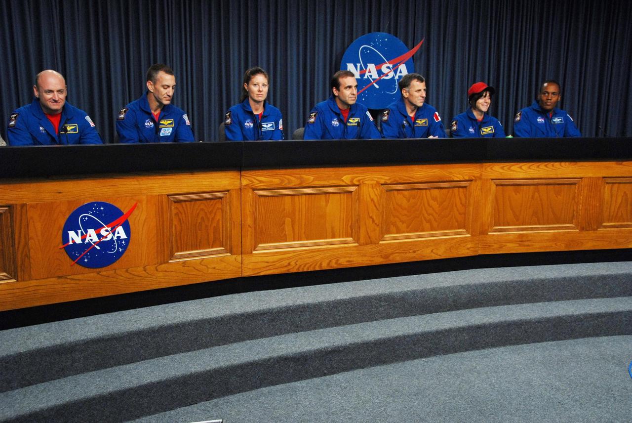 KENNEDY SPACE CENTER, FLA. --  At the NASA television studio, the STS-118 crew members participate in a news conference.  Seated from left are Commander Scott Kelly, Pilot Charlie Hobaugh and Mission Specialists Tracy Caldwell, Rick Mastracchio, Dave Williams, Barbara R. Morgan and Alvin Drew.  The crew has just returned from a 13-day mission to the International Space Station. On the mission, the crew installed a new gyroscope, an external spare parts platform and another truss segment to the expanding station.  STS-118 was the 119th space shuttle flight, the 22nd flight to the station, the 20th flight for Endeavour and the second of four missions planned for 2007.  Photo credit:  NASA/George Shelton
