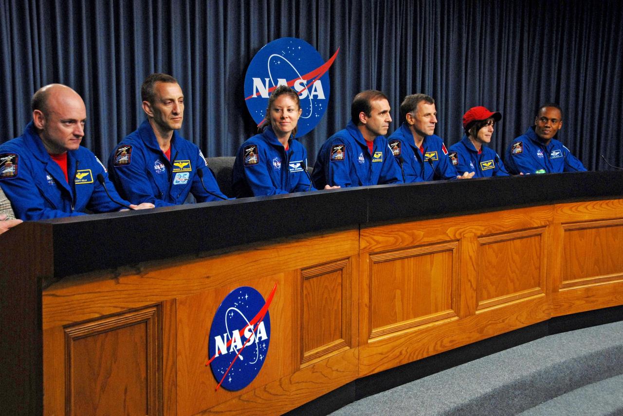 KENNEDY SPACE CENTER, FLA. --  At the NASA television studio, the STS-118 crew members answer questions from the media during a news conference.  Seated from left are Commander Scott Kelly, Pilot Charlie Hobaugh and Mission Specialists Tracy Caldwell, Rick Mastracchio, Dave Williams, Barbara R. Morgan and Alvin Drew.  The crew has just returned from a 13-day mission to the International Space Station. On the mission, the crew installed a new gyroscope, an external spare parts platform and another truss segment to the expanding station.  STS-118 was the 119th space shuttle flight, the 22nd flight to the station, the 20th flight for Endeavour and the second of four missions planned for 2007.  Photo credit:  NASA/George Shelton
