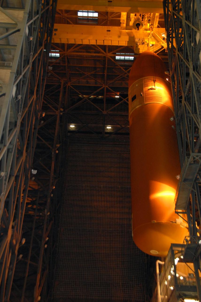 KENNEDY SPACE CENTER, FLA. --   In the Vehicle Assembly Building at NASA's Kennedy Space Center, external tank No. 120 is being lifted out of the checkout cell to high bay 1 where it will be mated with the solid rocket boosters. The external tank-SRB stack is being prepared for the orbiter Discovery, which will be mated to the stack in the VAB in two weeks.  Space Shuttle Discovery is targeted to launch Oct. 23 on mission STS-120 to the International Space Station.  Photo credit: NASA/George Shelton