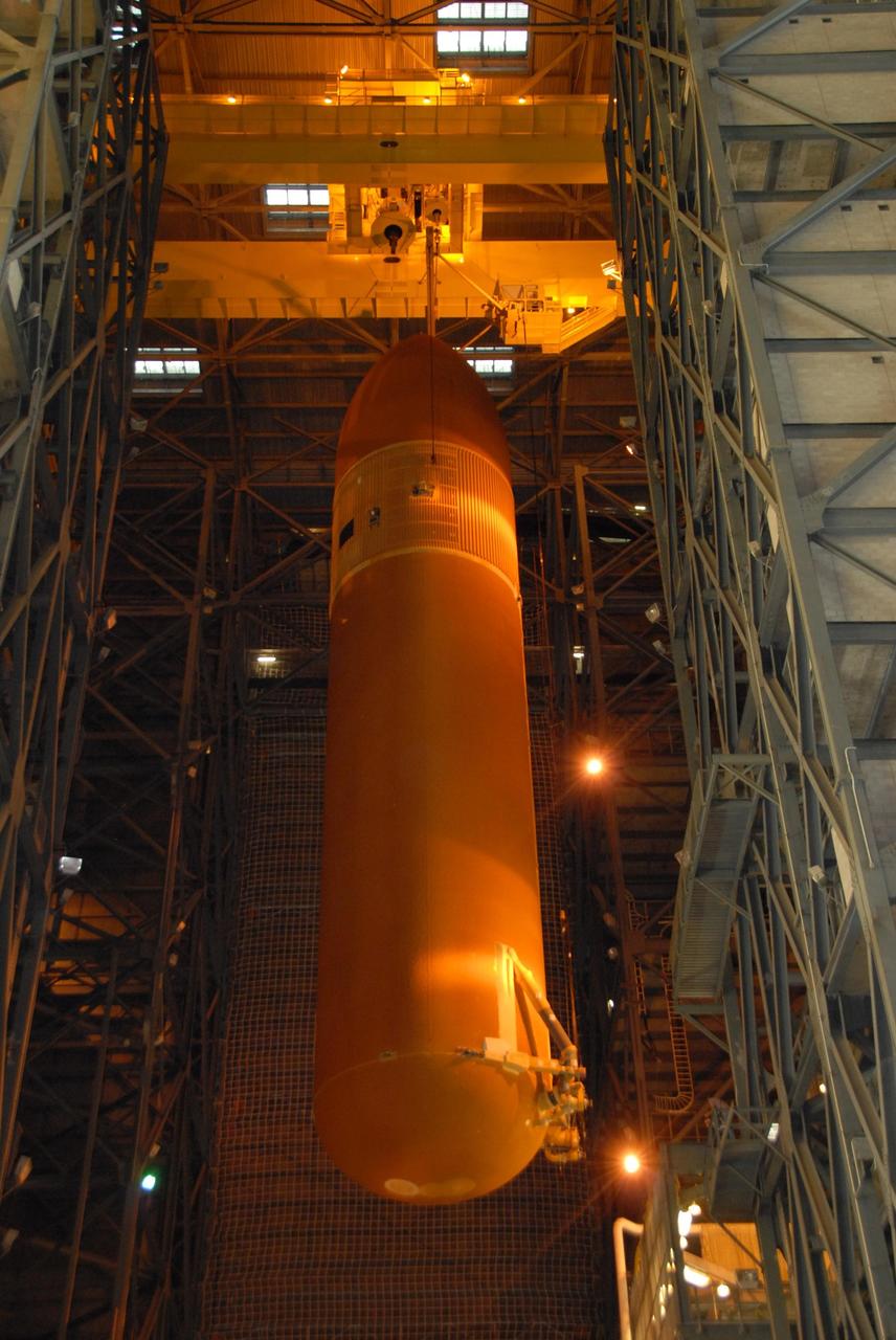 KENNEDY SPACE CENTER, FLA. --    In the Vehicle Assembly Building at NASA's Kennedy Space Center, external tank No. 120 is lowered into high bay 1 where it will be mated with the solid rocket boosters. The external tank-SRB stack is being prepared for the orbiter Discovery, which will be mated to the stack in the VAB in two weeks.  Space Shuttle Discovery is targeted to launch Oct. 23 on mission STS-120 to the International Space Station.  Photo credit: NASA/George Shelton