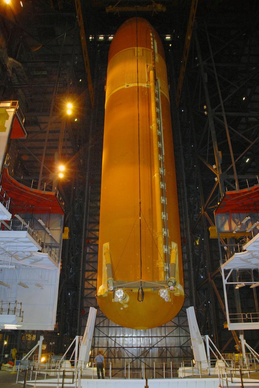 KENNEDY SPACE CENTER, FLA. --    In the Vehicle Assembly Building at NASA's Kennedy Space Center, external tank No. 120 is lowered toward the mobile launcher platform in high bay 1 where it will be mated with the solid rocket boosters already there. The external tank-SRB stack is being prepared for the orbiter Discovery, which will be mated to the stack in the VAB in two weeks.  Space Shuttle Discovery is targeted to launch Oct. 23 on mission STS-120 to the International Space Station.  Photo credit: NASA/George Shelton