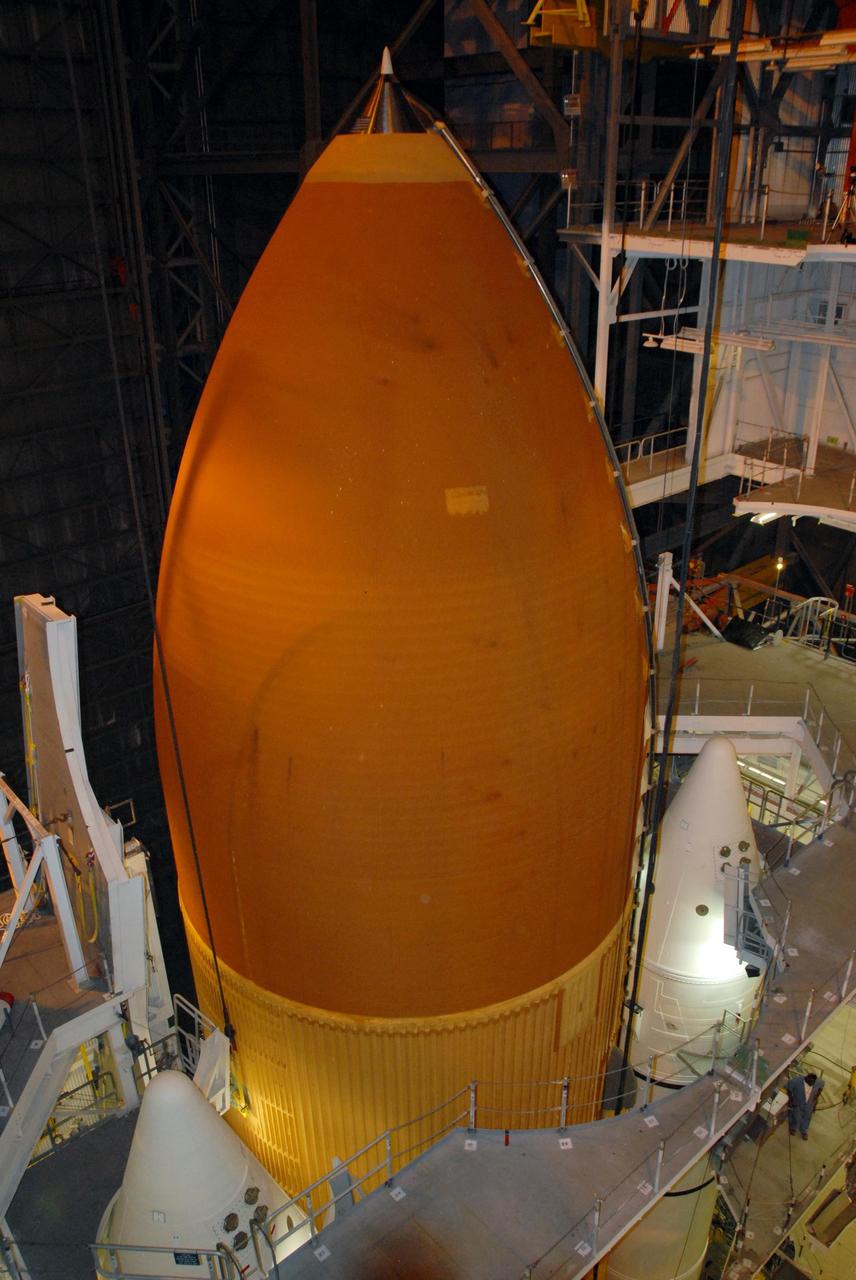 KENNEDY SPACE CENTER, FLA. --   In the Vehicle Assembly Building at NASA's Kennedy Space Center, the top of external tank No. 120 is seen as the tank is lowered between the solid rocket boosters for mating on the mobile launcher platform.  The external tank-SRB stack is being prepared for the orbiter Discovery, which will be mated to the stack in the VAB in two weeks.  Space Shuttle Discovery is targeted to launch Oct. 23 on mission STS-120 to the International Space Station.  Photo credit: NASA/George Shelton