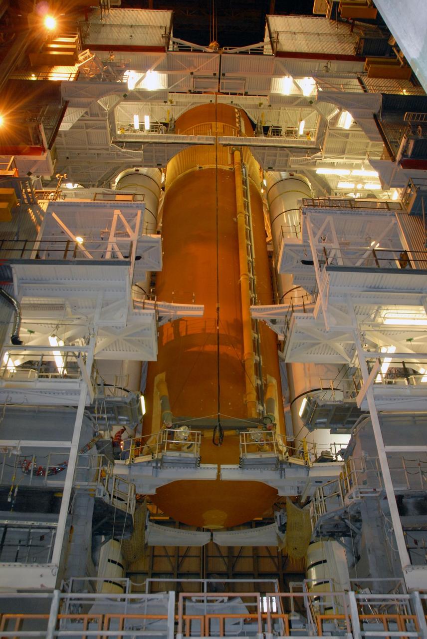 KENNEDY SPACE CENTER, FLA. -- In the Vehicle Assembly Building at NASA's Kennedy Space Center, external tank No. 120 has been lowered between the solid rocket boosters for mating on the mobile launcher platform.  The external tank-SRB stack is being prepared for the orbiter Discovery, which will be mated to the stack in the VAB in two weeks.  Space Shuttle Discovery is targeted to launch Oct. 23 on mission STS-120 to the International Space Station.  Photo credit: NASA/George Shelton