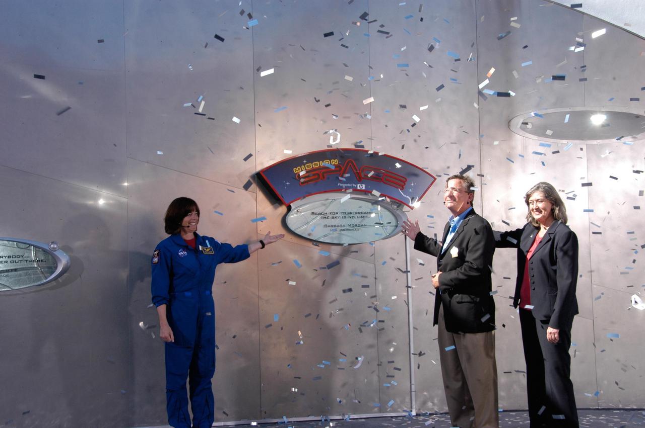 KENNEDY SPACE CENTER, FLA. -- During a special event at Walt Disney World in Orlando honoring the crew of space shuttle mission STS-118, Mission Specialist Barbara R. Morgan (left) helps dedicate a plaque outside the Mission: Space attraction.  At right are Vice President of Epcot Jim MacPhee and NASA Assistant Administrator for Education Joyce Winterton. Along with the dedication, the crew met with students and media and paraded down Main Street to the delight of the crowds.  The other crew members attending were Commander Scott Kelly, Pilot Charlie Hobaugh and Mission Specialists Tracy Caldwell, Rick Mastracchio, Dave Williams and Alvin Drew. Mission STS-118 was the 119th shuttle program flight and the 22nd flight to the International Space Station.  Space shuttle Endeavour launched from NASA's Kennedy Space Center on Aug. 8 and landed Aug. 21.  The mission delivered the S5 truss, continuing the assembly of the space station.  Photo credit: NASA/George Shelton