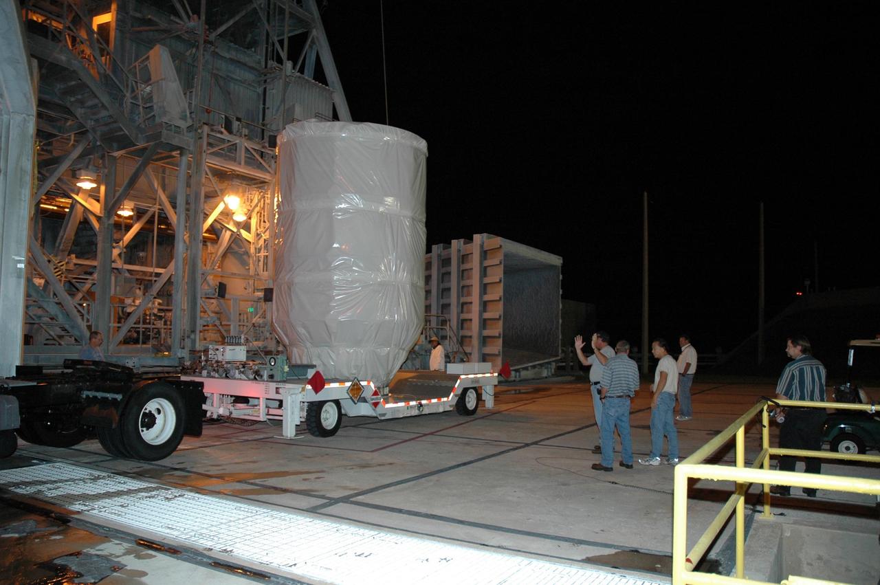 KENNEDY SPACE CENTER, FLA. -- The Dawn spacecraft arrives on Launch Pad 17-B at Cape Canaveral Air Force Station.  At the pad, Dawn will be lifted into the mobile service tower and prepared for mating with the awaiting Delta II rocket. Dawn is scheduled for launch in a window from 7:25 to 7:54 a.m. Sept. 26 from CCAFS.  During its nearly decade-long mission, the Dawn mission will study the asteroid Vesta and dwarf planet Ceres, celestial bodies believed to have accreted early in the history of the solar system. To carry out its scientific mission, the Dawn spacecraft will carry a visible camera, a visible and infrared mapping spectrometer, and a gamma ray and neutron spectrometer, whose data will be used in combination to characterize these bodies.  In addition to the three instruments, radiometric and optical navigation data will provide data relating to the gravity field and thus bulk properties and internal structure of the two bodies. Data returned from the Dawn spacecraft could provide opportunities for significant breakthroughs in our knowledge of how the solar system formed. Photo credit: NASA/Jack Pfaller