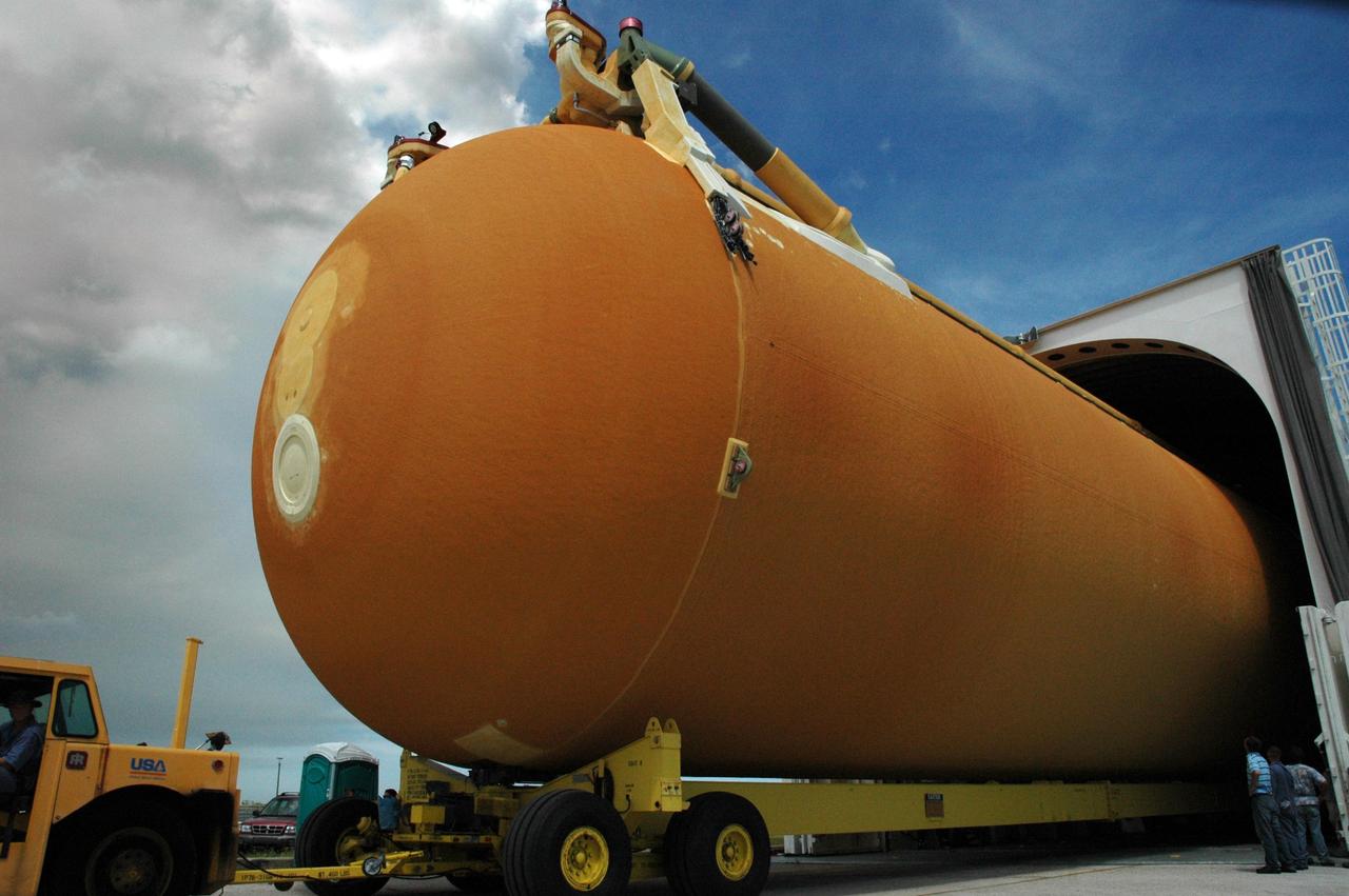 KENNEDY SPACE CENTER, FLA. -- External tank No. 125 is moved out of the Pegasus barge at the Launch Complex 39 Area turn basin. After offloading, the tank will be transported to the Vehicle Assembly Building. The tank arrived at Kennedy on the Pegasus barge from the Michoud Assembly Facility near New Orleans. The external tank will be used on space shuttle Atlantis for mission STS-122 targeted for launch on Dec. 6. Photo credit: NASA/Troy Cryder