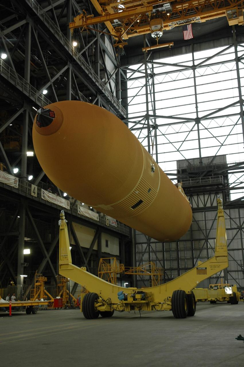 KENNEDY SPACE CENTER, FLA. -- In the transfer aisle of the Vehicle Assembly Building, external tank No. 125 is raised off its transporter. The tank will be raised to a vertical position and then lifted into a checkout cell in high bay 4 to allow for processing. The tank will be part of the space shuttle stack for mission STS-122 targeted to launch Dec. 6. Photo credit: NASA/Troy Cryder