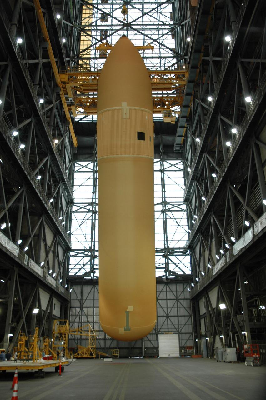 KENNEDY SPACE CENTER, FLA. -- Above the transfer aisle of the Vehicle Assembly Building, external tank No. 125 has been raised to a nearly vertical position. It will next be lifted into a checkout cell in high bay 4 to allow for processing. The tank will be part of the space shuttle stack for mission STS-122 targeted to launch Dec. 6. Photo credit: NASA/Troy Cryder