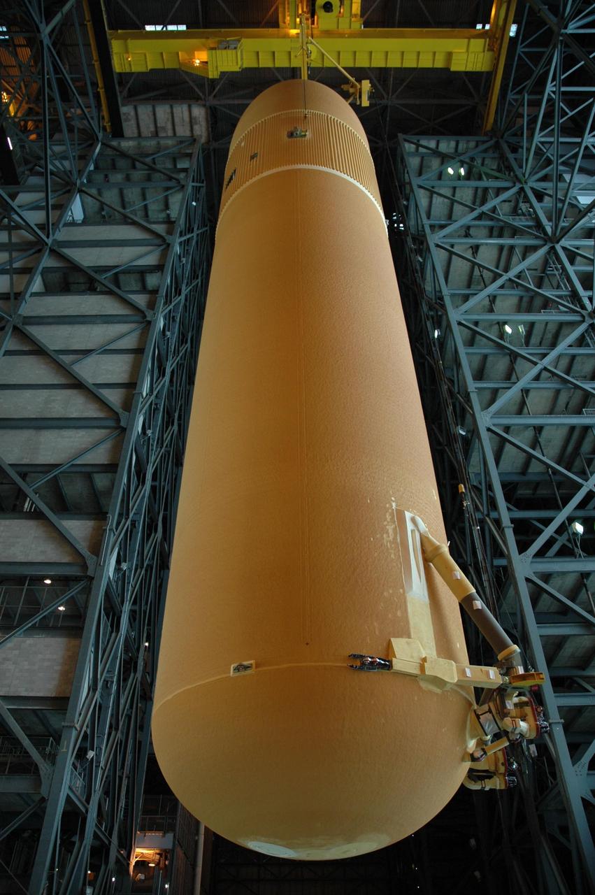 KENNEDY SPACE CENTER, FLA. -- Seen from below, external tank No. 125 is being lifted high into the upper levels of the Vehicle Assembly Building for transfer to a checkout cell in high bay 4 to allow for processing. The tank will be part of the space shuttle stack for mission STS-122 targeted to launch Dec. 6. Photo credit: NASA/Troy Cryder