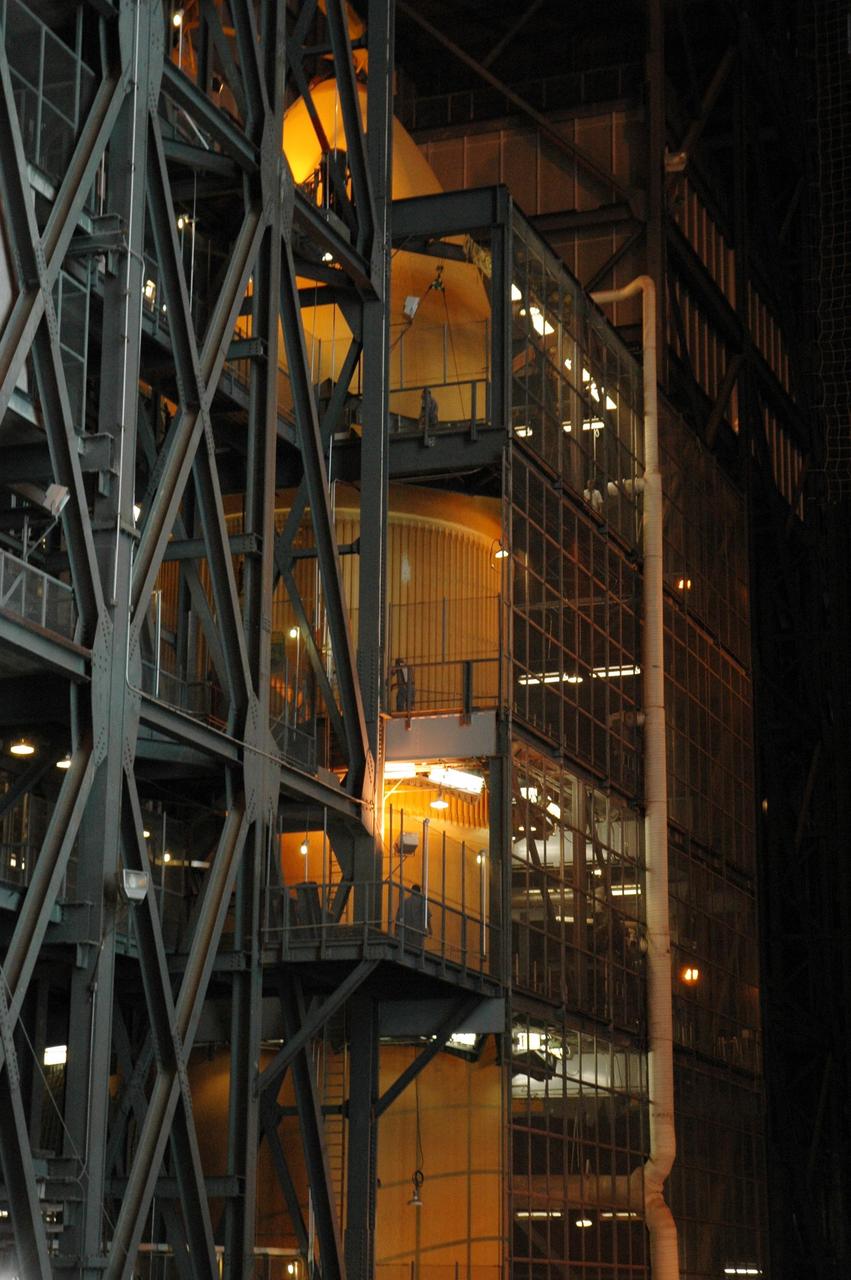 KENNEDY SPACE CENTER, FLA. --   After its lift and transfer inside the Vehicle Assembly Building, external tank No. 125 is suspended in a checkout cell in high bay 4 for processing. The tank will be part of the space shuttle stack for mission STS-122 targeted to launch Dec. 6.  Photo credit: NASA/Troy Cryder