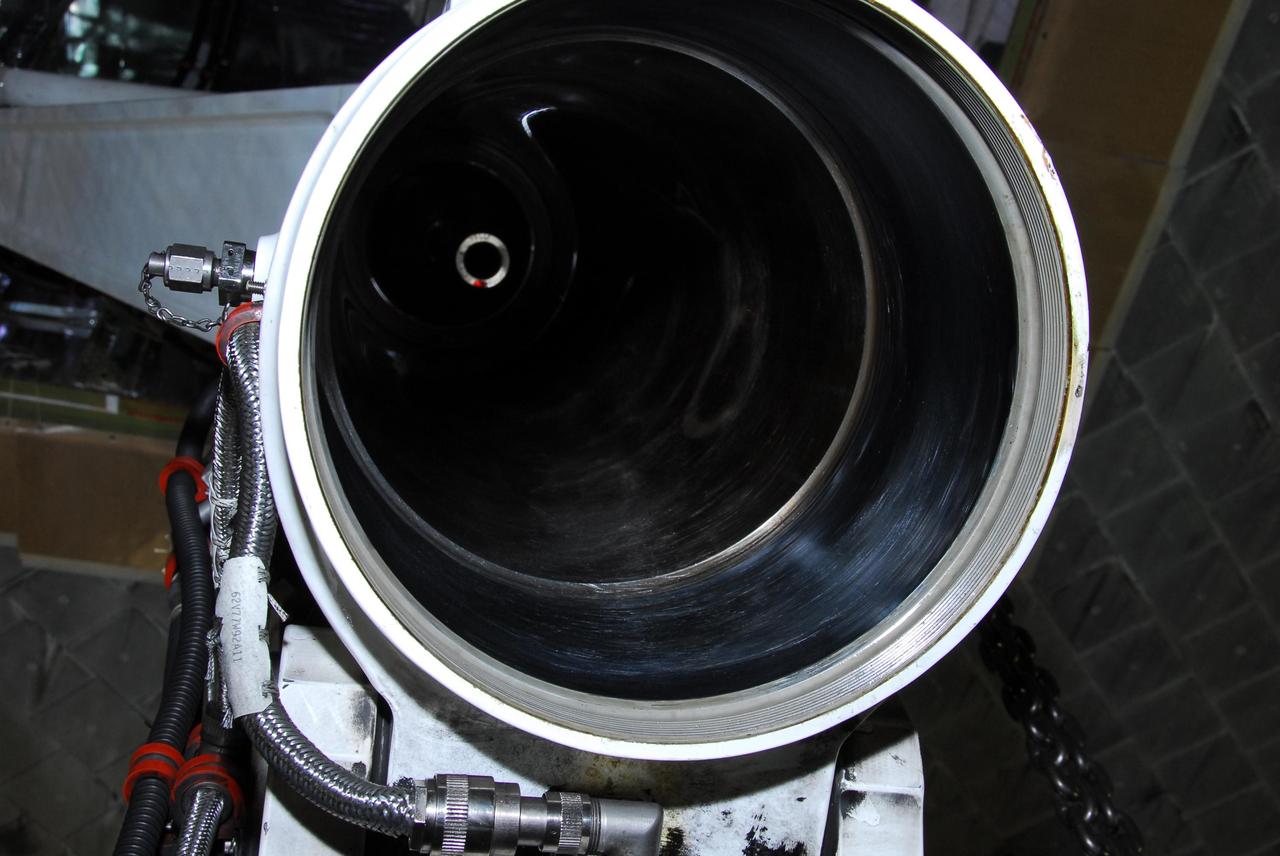 KENNEDY SPACE CENTER, FLA. -- This photo looks inside space shuttle Discovery's right main-gear strut where a leaking seal has been found.  United Space Alliance and B.F. Goodrich technicians will replace a leaking dynamic seal in Discovery's right main-gear strut.  The struts act as shock absorbers during the shuttle's landing.  Engineers determined the observed leak of hydraulic fluid in the main landing gear strut exceeded specification and could not be reduced to an acceptable rate. Removing the strut and replacing seals require disconnecting and replacing the brakes and tires, disconnecting and reconnecting instruments and other requirements to allow access to the strut.  Discovery had been scheduled to roll over Sept. 19 from its processing hangar to the Vehicle Assembly Building. A new rollover date will be set after technicians determine how long replacing the seal will take.  Photo credit: NASA/George Shelton