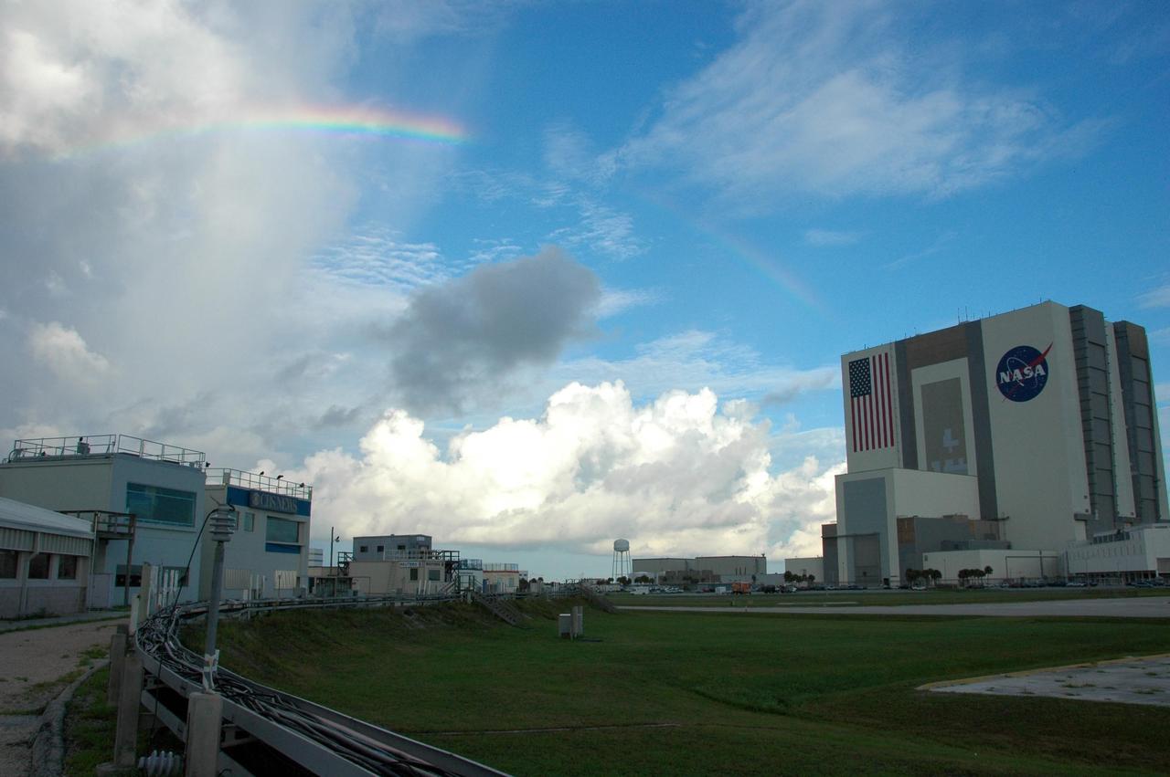 KENNEDY SPACE CENTER, FLA. -- A rainbow arcs over NASA's Kennedy Space Center in the Launch Complex 39Area. At right is the Vehicle Assembly Building; at left is the NASA News Center. Photo credit: NASA/Amanda Diller