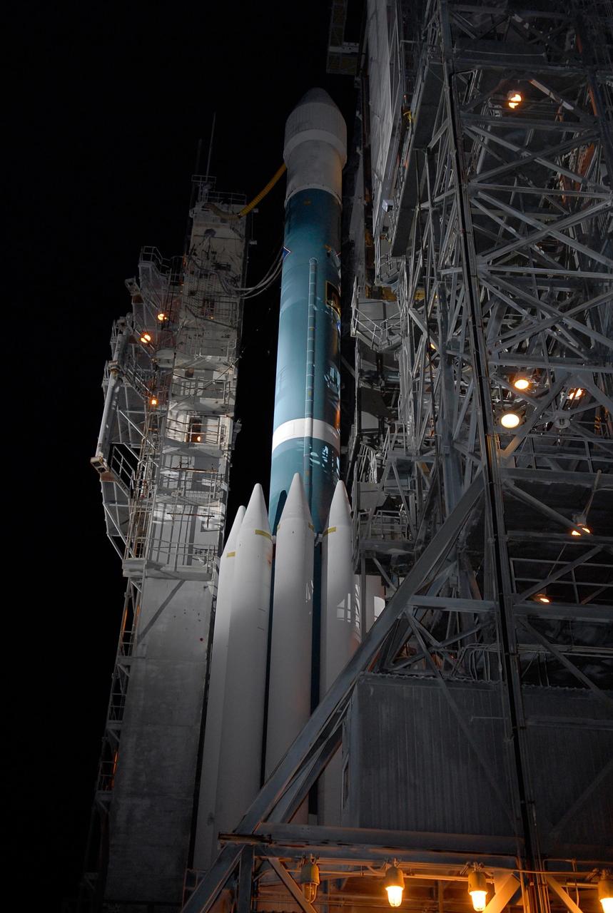KENNEDY SPACE CENTER, FLA. -- The Delta II rocket is revealed as the mobile service tower, or gantry (at left), is retracted on Launch Pad 17B at Cape Canaveral Air Force Station. Starting with a boost from this higher thrust version of the Delta II rocket, the Dawn spacecraft will study the asteroid Vesta and dwarf planet Ceres, celestial bodies believed to have accreted early in the history of the solar system. To carry out its scientific mission during its nearly decade-long mission, Dawn will carry a visible camera, a visible and infrared mapping spectrometer, and a gamma ray and neutron spectrometer, whose data will be used in combination to characterize these bodies. In addition to the three instruments, radiometric and optical navigation data will provide data relating to the gravity field, and thus, bulk properties and internal structure of the two bodies. Data returned from the Dawn spacecraft could provide opportunities for significant breakthroughs in our knowledge of how the solar system formed. Launch is targeted for Sept. 27 during a window that extends from 7:20 to 7:49 a.m. EDT. Photo credit: NASA/Kim Shiflett