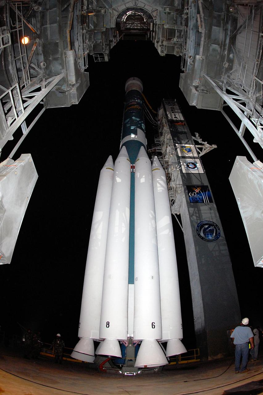 KENNEDY SPACE CENTER, FLA. -- A worker monitors the progress of the retraction of the mobile service tower, or gantry, from the Delta II rocket on Launch Pad 17B at Cape Canaveral Air Force Station. Starting with a boost from this higher thrust version of the Delta II rocket, the Dawn spacecraft will study the asteroid Vesta and dwarf planet Ceres, celestial bodies believed to have accreted early in the history of the solar system. To carry out its scientific mission during its nearly decade-long mission, Dawn will carry a visible camera, a visible and infrared mapping spectrometer, and a gamma ray and neutron spectrometer, whose data will be used in combination to characterize these bodies. In addition to the three instruments, radiometric and optical navigation data will provide data relating to the gravity field, and thus, bulk properties and internal structure of the two bodies. Data returned from the Dawn spacecraft could provide opportunities for significant breakthroughs in our knowledge of how the solar system formed. Launch is targeted for Sept. 27 during a window that extends from 7:20 to 7:49 a.m. EDT. Photo credit: NASA/Kim Shiflett