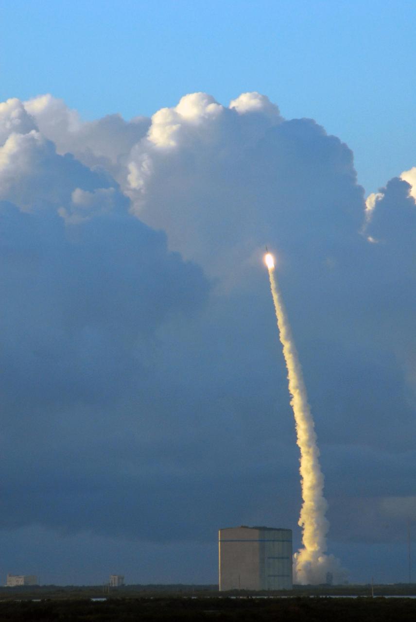 KENNEDY SPACE CENTER, FLA. -- Rising into billowing clouds above the horizon, the Delta II rocket carrying the Dawn spacecraft roars into the sky. Liftoff was at 7:34 a.m. EDT from Pad 17-B at Cape Canaveral Air Force Station. Dawn is the ninth mission in NASA's Discovery Program. The spacecraft will be the first to orbit two planetary bodies, asteroid Vesta and dwarf planet Ceres, during a single mission. Vesta and Ceres lie in the asteroid belt between Mars and Jupiter. It is also NASA's first purely scientific mission powered by three solar electric ion propulsion engines. Photo credit: NASA/George Shelton