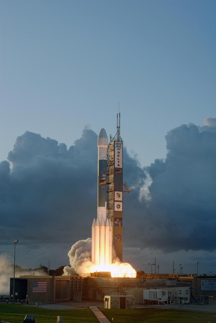 KENNEDY SPACE CENTER, FLA. -- Against a backdrop of clouds on the horizon, the Delta II rocket carrying NASA's Dawn spacecraft rises from the smoke and fire on the launch pad to begin its 1.7-billion-mile journey through the inner solar system to study a pair of asteroids. Liftoff was at 7:34 a.m. EDT from Pad 17-B at Cape Canaveral Air Force Station. Dawn is the ninth mission in NASA's Discovery Program. The spacecraft will be the first to orbit two planetary bodies, asteroid Vesta and dwarf planet Ceres, during a single mission. Vesta and Ceres lie in the asteroid belt between Mars and Jupiter. It is also NASA's first purely scientific mission powered by three solar electric ion propulsion engines. Photo credit: NASA/Sandra Joseph & Rafael Hernandez