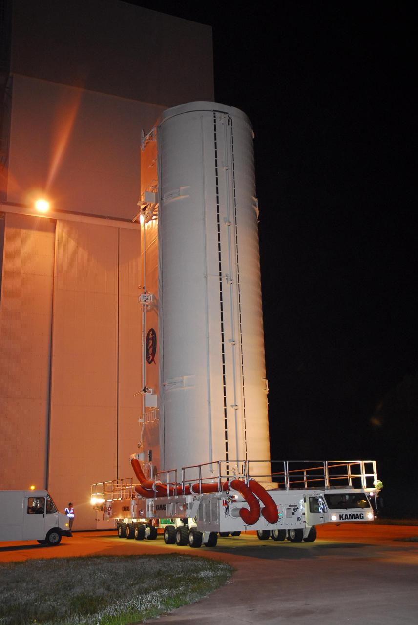 KENNEDY SPACE CENTER, FLA. -- The payload canister containing the Italian-built U.S. Node 2 module, called Harmony, begins taking its cargo to Launch Pad 39A.  At the pad, the canister will be lifted to the payload changeout room and the module transferred inside.  The payload will be installed in space shuttle Discovery's payload bay after the vehicle rolls out to the pad.  Discovery is targeted for launch to the International Space Station for mission STS-120 on Oct. 23.   The pressurized module will act as an internal connecting port and passageway to additional international science labs and cargo spacecraft.  Photo credit: NASA/George Shelton