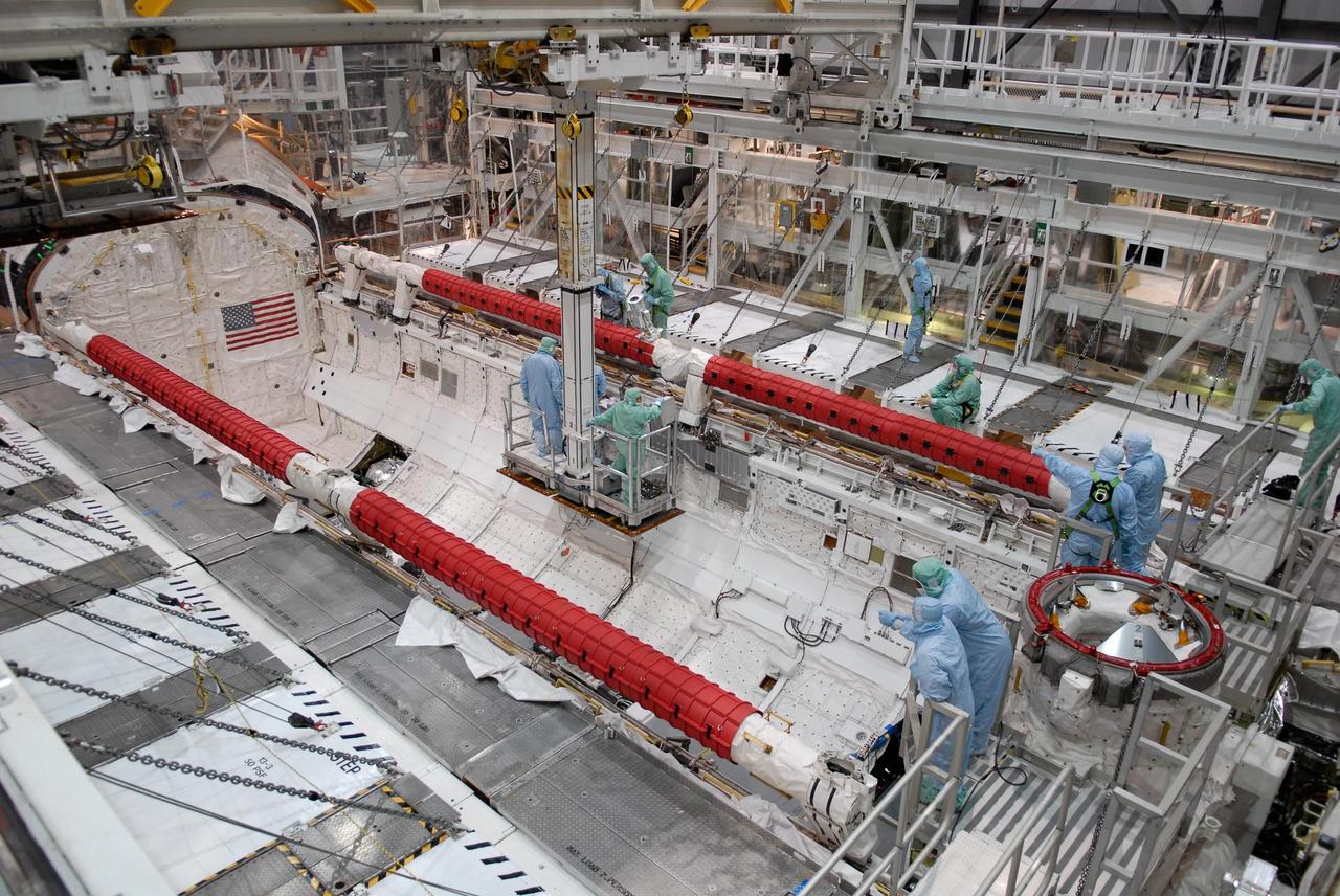KENNEDY SPACE CENTER, FLA. --   STS-122 crew members get a close look at shuttle equipment from inside the payload bay of space shuttle Atlantis.  The crew comprises six astronauts: Commander Stephen Frick, Pilot Alan Poindexter and Mission Specialists Rex Walheim, Stanley Love, Leland Melvin and Hans Schlegel, who represents the European Space Agency.  A seventh astronaut is Leopold Eyharts, also with the ESA, who will join the Expedition 16 crew as flight engineer on the International Space Station. The mission will carry and install the Columbus Lab,  a multifunctional, pressurized laboratory that will be permanently attached to Node 2 of the space station to carry out experiments in materials science, fluid physics and biosciences, as well as to perform a number of technological applications. It is Europe’s largest contribution to the construction of the International Space Station and will support scientific and technological research in a microgravity environment.  STS-122 is targeted for launch in December.   Photo credit: NASA/Kim Shiflett