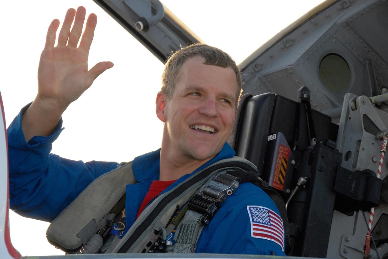 KENNEDY SPACE CENTER, FLA. -- The crew members of mission STS-120 arrive at NASA's Kennedy Space Center Shuttle Landing Facility aboard T-38 jet aircraft to take part in terminal countdown demonstration test activities. Mission Specialist Scott Parazynski, who will be making his fifth shuttle flight, waves to those on hand to greet him. The terminal countdown demonstration test provides astronauts and ground crews an opportunity to participate in various simulated countdown activities, including equipment familiarization and emergency training. The STS-120 mission will deliver the U.S. Node 2 module, named Harmony, aboard space shuttle Discovery to the International Space Station. Launch of Discovery on mission STS-120 is targeted for Oct. 23 at 11:38 a.m. EDT on a 14-day mission to the International Space Station. Photo credit: NASA/Kim Shiflett