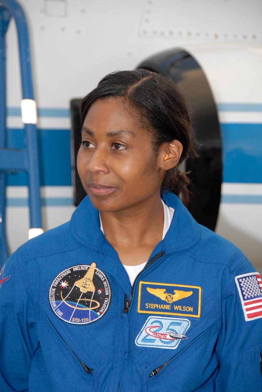 KENNEDY SPACE CENTER, FLA. -- The crew members of mission STS-120 arrive at NASA's Kennedy Space Center Shuttle Landing Facility aboard T-38 jet aircraft to take part in terminal countdown demonstration test activities. Mission Specialist Stephanie Wilson, seen here, will be making her second shuttle flight. The terminal countdown demonstration test provides astronauts and ground crews an opportunity to participate in various simulated countdown activities, including equipment familiarization and emergency training. The STS-120 mission will deliver the U.S. Node 2 module, named Harmony, aboard space shuttle Discovery to the International Space Station. Launch of Discovery on mission STS-120 is targeted for Oct. 23 at 11:38 a.m. EDT on a 14-day mission to the International Space Station. Photo credit: NASA/Kim Shiflett