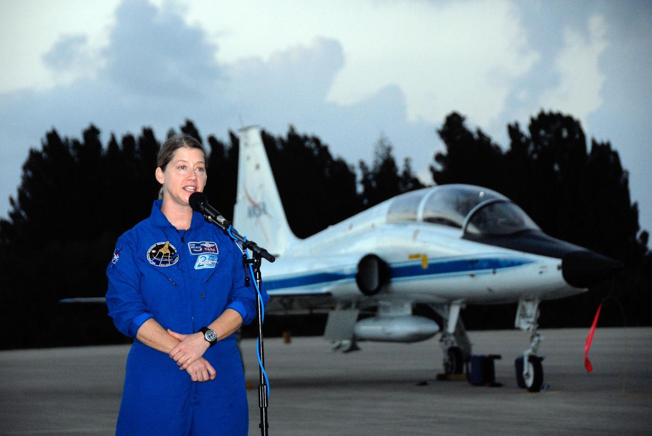 KENNEDY SPACE CENTER, FLA. -- STS-120 Commander Pam Melroy addresses the media following the arrival of the STS-120 crew at NASA's Kennedy Space Center Shuttle Landing Facility aboard T-38 jet aircraft. The crew is at Kennedy to take part in terminal countdown demonstration test activities and also includes Pilot George Zamka and Mission Specialists Paolo Nespoli, Doug Wheelock, Stephanie Wilson, Scott Parazynski and Daniel Tani, who will remain of the International Space Station as a member of the Expedition 16 crew. The terminal countdown demonstration test provides astronauts and ground crews an opportunity to participate in various simulated countdown activities, including equipment familiarization and emergency training. The STS-120 mission will deliver the U.S. Node 2 module, named Harmony, aboard space shuttle Discovery to the International Space Station. Launch of Discovery on mission STS-120 is targeted for Oct. 23 at 11:38 a.m. EDT on a 14-day mission to the International Space Station. Photo credit: NASA/Kim Shiflett