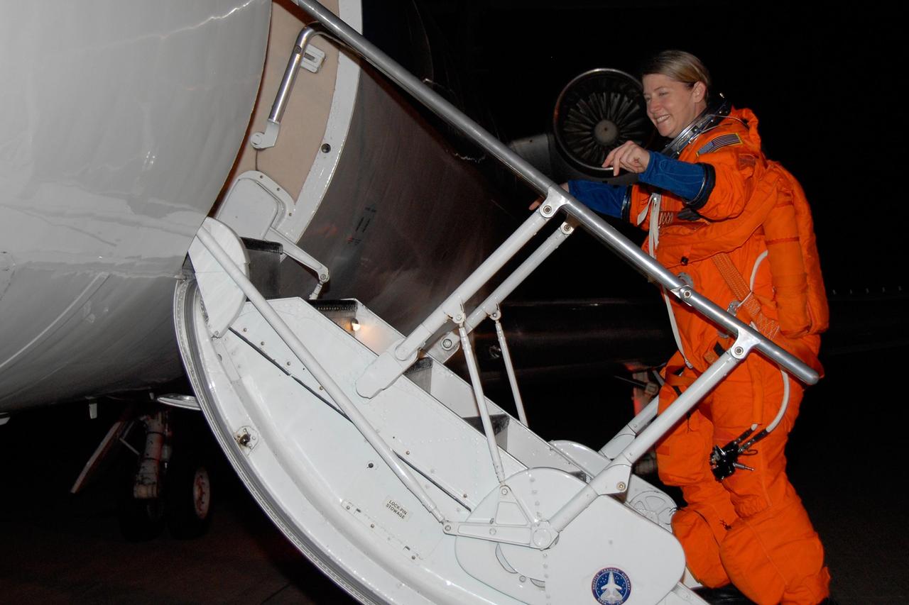 KENNEDY SPACE CENTER, FLA. --  STS-120 Commander Pamela Melroy is eager to enter the shuttle training aircraft, or STA, to practice landing on NASA's Shuttle Landing Facility runway.  A modified Grumman American Aviation-built Gulf Stream II jet, the STA simulates an orbiter's cockpit, motion and visual cues and handling qualities. In flight, the STA duplicates the orbiter's atmospheric descent trajectory from approximately 35,000 feet altitude to landing on a runway.  Melroy and other crew members are at Kennedy Space Center to take part in the terminal countdown demonstration test, which also includes a simulated launch countdown. Mission STS-120 is targeted for Oct. 23.  Photo credit: NASA/Kim Shiflett