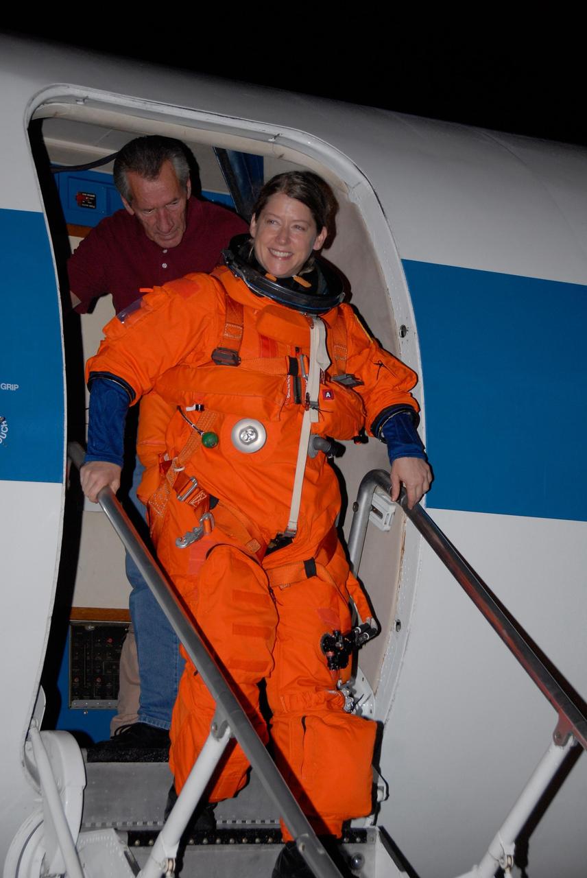 KENNEDY SPACE CENTER, FLA. --  STS-120 Commander Pamela Melroy disembarks from the shuttle training aircraft, or STA, after successful landing practice on NASA's Shuttle Landing Facility runway.  A modified Grumman American Aviation-built Gulf Stream II jet, the STA simulates an orbiter's cockpit, motion and visual cues and handling qualities. In flight, the STA duplicates the orbiter's atmospheric descent trajectory from approximately 35,000 feet altitude to landing on a runway.  Melroy and other crew members are at Kennedy Space Center to take part in the terminal countdown demonstration test, which also includes a simulated launch countdown. Mission STS-120 is targeted for Oct. 23.  Photo credit: NASA/Kim Shiflett