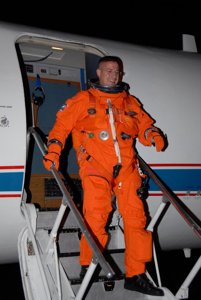 KENNEDY SPACE CENTER, FLA. -- STS-120 Pilot George Zamka disembarks from the shuttle training aircraft, or STA, after successful landing practice on NASA's Shuttle Landing Facility runway. A modified Grumman American Aviation-built Gulf Stream II jet, the STA simulates an orbiter's cockpit, motion and visual cues and handling qualities. In flight, the STA duplicates the orbiter's atmospheric descent trajectory from approximately 35,000 feet altitude to landing on a runway. Melroy and other crew members are at Kennedy Space Center to take part in the terminal countdown demonstration test, which also includes a simulated launch countdown. Mission STS-120 is targeted for Oct. 23. Photo credit: NASA/Kim Shiflett