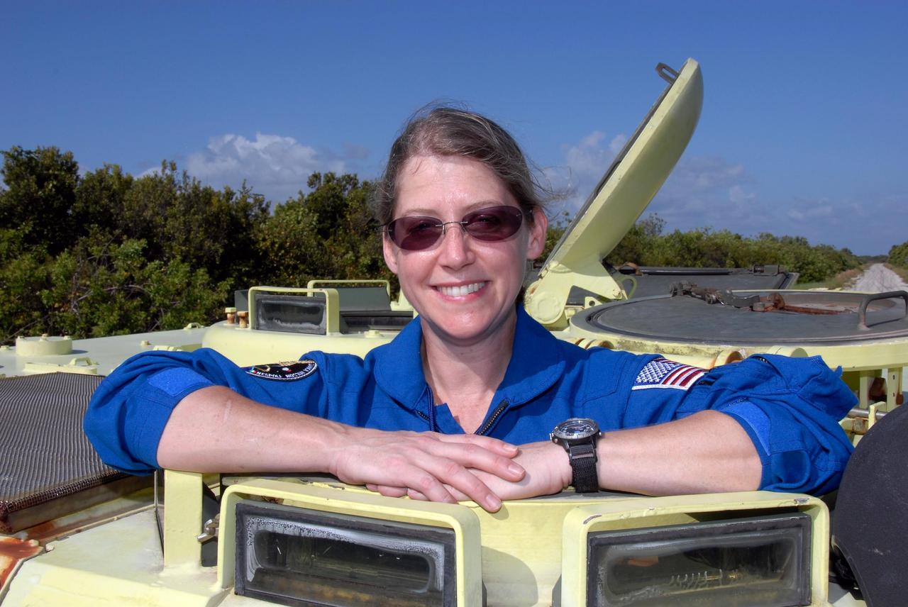 KENNEDY SPACE CENTER, FLA. --  STS-120 Commander Pamela Melroy is ready for her turn at driving practice in the M-113 armored personnel carrier. The M-113 is part of emergency exit procedures from Launch Pad 39A.  The training is part of terminal countdown demonstration test, or TCDT, activities the crew is undertaking at NASA's Kennedy Space Center. The TCDT also includes equipment familiarization and a simulated launch countdown. Mission STS-120, which will carry the Italian-built U.S. Node 2 to the International Space Station, is targeted for launch on Oct. 23.  Photo credit: NASA/Kim Shiflett