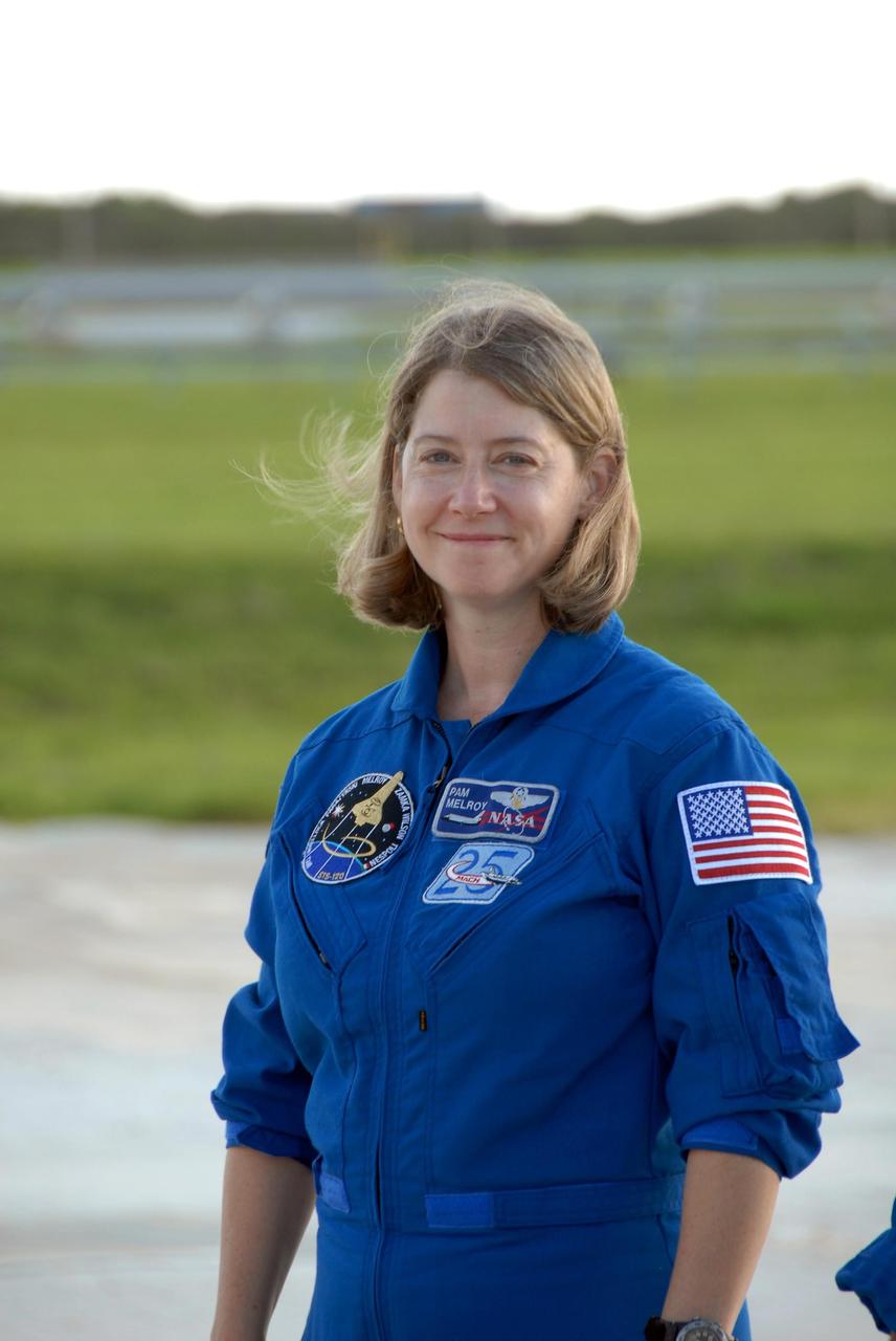 KENNEDY SPACE CENTER, FLA. --  STS-120 Commander Pamela Melroy takes the stage with her shuttle crew on Launch Pad 39A for a media conference.  The crew is at NASA's Kennedy Space Center to take part in terminal countdown demonstration test activities that include emergency egress procedures and a simulated launch countdown. Mission STS-120, which will carry the Italian-built U.S. Node 2 to the International Space Station, is targeted for launch on Oct. 23. Tani will remain aboard the station and return with the STS-122 crew, targeted to launch Dec. 6.  Photo credit: NASA/Kim Shiflett