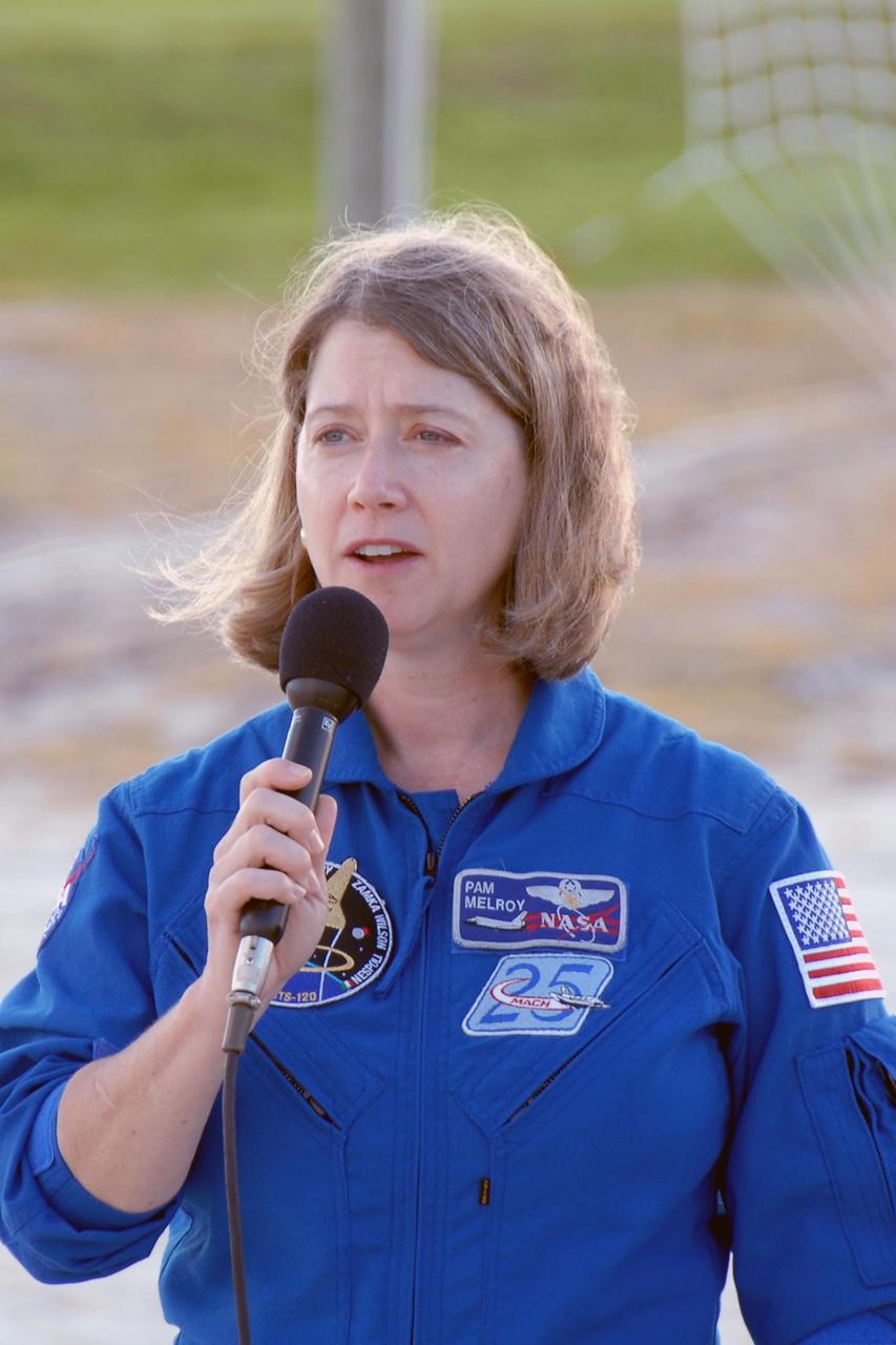 KENNEDY SPACE CENTER, FLA. --  STS-120 Commander Pamela Melroy responds to a question from the media during a press conference at the slidewire basket landing on Launch Pad 39A.  The crew is at NASA's Kennedy Space Center to take part in terminal countdown demonstration test activities that include emergency egress procedures and a simulated launch countdown.   Mission STS-120, which will carry the Italian-built U.S. Node 2 to the International Space Station, is targeted for launch on Oct. 23. Tani will remain aboard the station and return with the STS-122 crew, targeted to launch Dec. 6.  Photo credit: NASA/Kim Shiflett