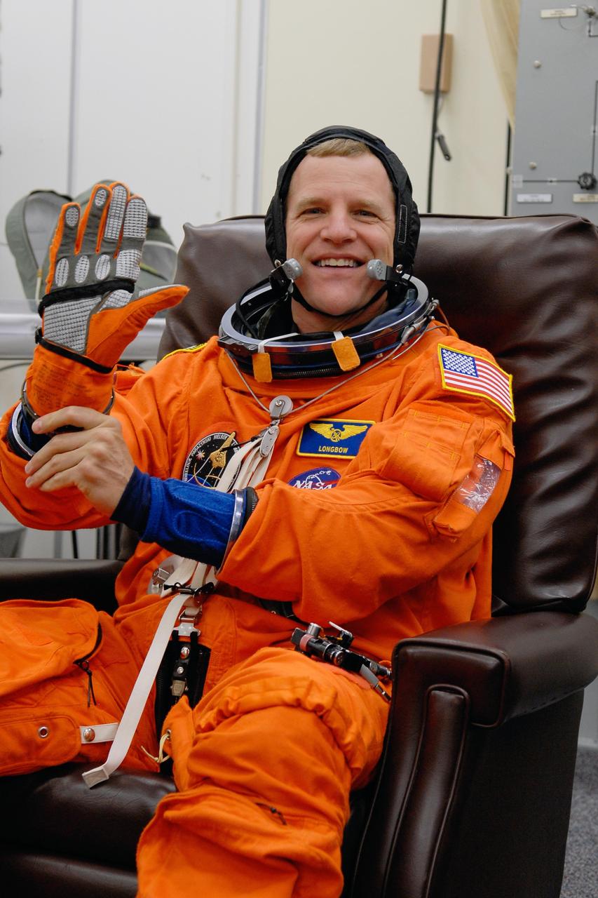 KENNEDY SPACE CENTER, FLA. -- STS-120 Mission Specialist Scott Parazynski is putting on his launch and entry suit for a simulated launch countdown, part of the prelaunch terminal countdown demonstration test, or TCDT.  His name patch reflects the nicknames the crew gave each other for the event. The TCDT provides astronauts and ground crews an opportunity to participate in various launch preparation activities, including equipment familiarization,  emergency training and the simulated countdown. The STS-120 mission will deliver the U.S. Node 2 module, named Harmony, aboard space shuttle Discovery to the International Space Station.  Launch of Discovery on mission STS-120 is targeted for Oct. 23 at 11:38 a.m. EDT on a 14-day mission. Photo credit: NASA/Kim Shiflett