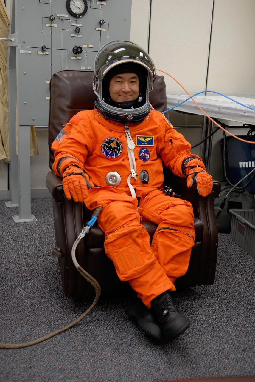 KENNEDY SPACE CENTER, FLA. --  STS-120 Mission Specialist Daniel Tani is fully suited and ready to take part in a simulated launch countdown, part of the prelaunch terminal countdown demonstration test, or TCDT. His name patch reflects the nicknames the crew gave each other for the event. The TCDT provides astronauts and ground crews an opportunity to participate in various launch preparation activities, including equipment familiarization,  emergency training and the simulated countdown. The STS-120 mission will deliver the U.S. Node 2 module, named Harmony, aboard space shuttle Discovery to the International Space Station.  Launch of Discovery on mission STS-120 is targeted for Oct. 23 at 11:38 a.m. EDT on a 14-day mission. Photo credit: NASA/Kim Shiflett
