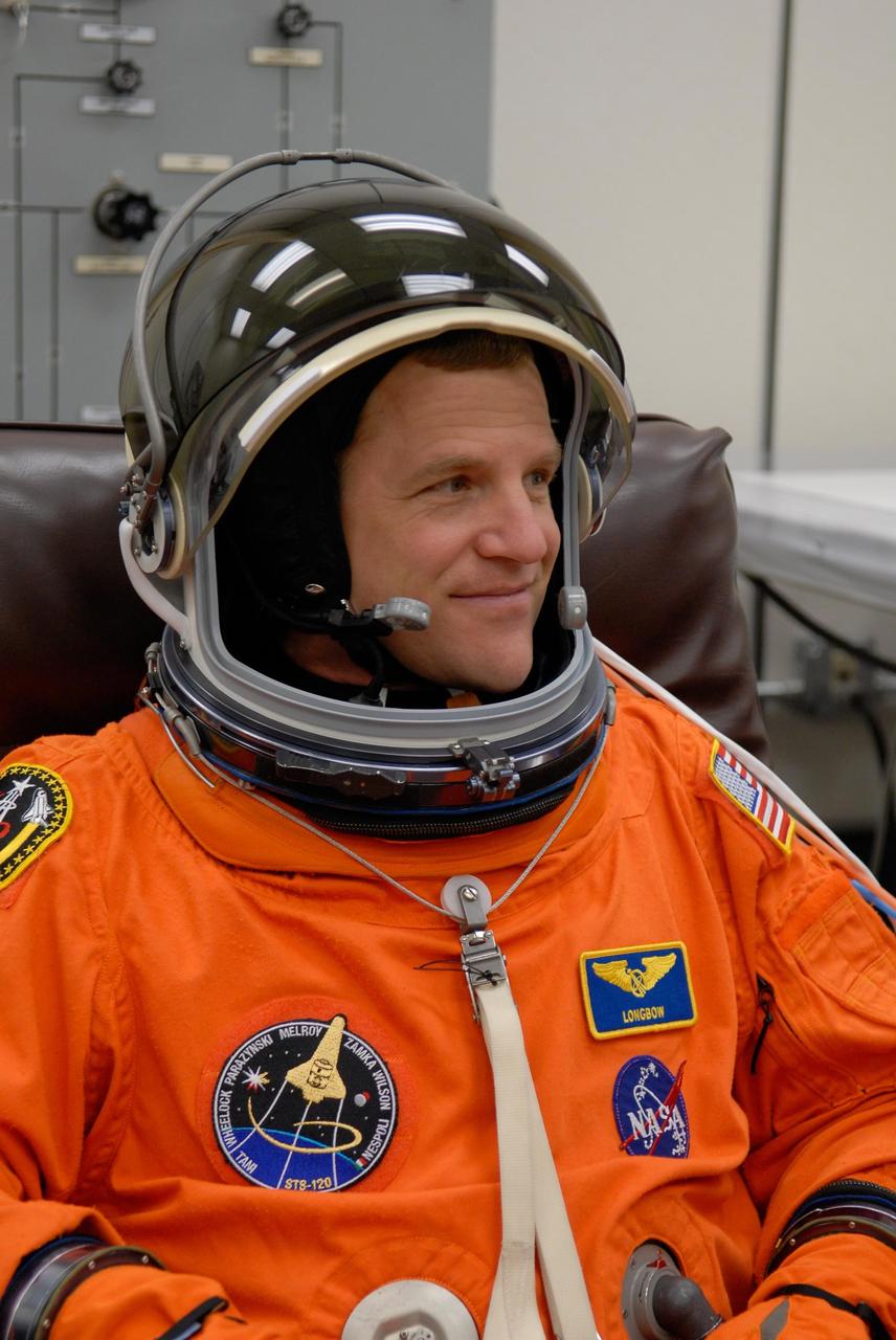 KENNEDY SPACE CENTER, FLA. --  STS-120 Mission Specialist Scott Parazynski completes suiting up to take part in a simulated launch countdown, part of the prelaunch terminal countdown demonstration test, or TCDT. His name patch reflects the nicknames the crew gave each other for the event.  The TCDT provides astronauts and ground crews an opportunity to participate in various launch preparation activities, including equipment familiarization,  emergency training and the simulated countdown. The STS-120 mission will deliver the U.S. Node 2 module, named Harmony, aboard space shuttle Discovery to the International Space Station.  Launch of Discovery on mission STS-120 is targeted for Oct. 23 at 11:38 a.m. EDT on a 14-day mission. Photo credit: NASA/Kim Shiflett