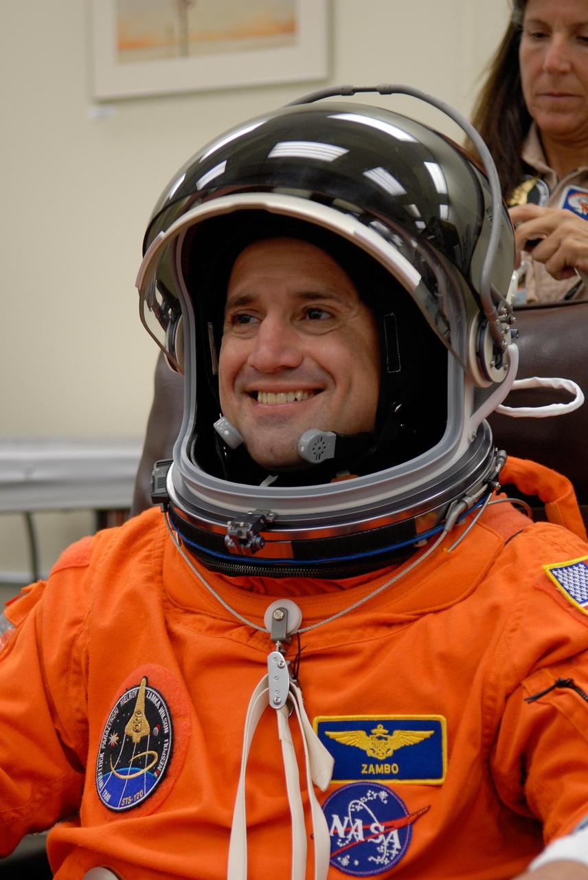 KENNEDY SPACE CENTER, FLA. -- STS-120 Pilot George Zamka completes suiting up to take part in a simulated launch countdown, part of the prelaunch terminal countdown demonstration test, or TCDT.  His name patch reflects the nicknames the crew gave each other for the event.  The TCDT provides astronauts and ground crews an opportunity to participate in various launch preparation activities, including equipment familiarization,  emergency training and the simulated countdown. The STS-120 mission will deliver the U.S. Node 2 module, named Harmony, aboard space shuttle Discovery to the International Space Station.  Launch of Discovery on mission STS-120 is targeted for Oct. 23 at 11:38 a.m. EDT on a 14-day mission. Photo credit: NASA/Kim Shiflett