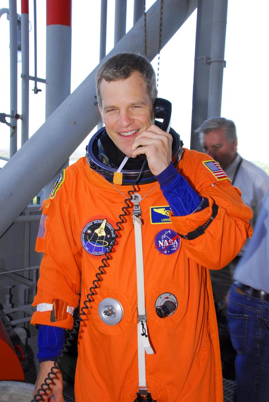 KENNEDY SPACE CENTER, FLA. -- STS-120 Mission Specialist Scott Parazynski arrives on Launch Pad 39A to start a simulated launch countdown, culmination of the prelaunch terminal countdown demonstration test, or TCDT.  His name patch reflects the nicknames the crew gave each other for the event. The TCDT at NASA's Kennedy Space Center provides astronauts and ground crews an opportunity to participate in various launch preparation activities, including equipment familiarization and  emergency training. The STS-120 mission will deliver the U.S. Node 2 module, named Harmony, aboard space shuttle Discovery to the International Space Station.  Discovery is targeted to launch on its 14-day mission at 11:38 a.m. EDT on Oct. 23. Photo credit: NASA/George Shelton