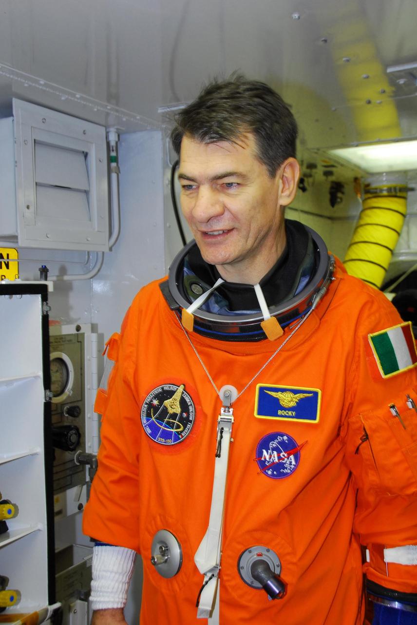 KENNEDY SPACE CENTER, FLA. -- STS-120 Mission Specialist Paolo Nespoli arrives in the white room on Launch Pad 39A. After donning a parachute pack, he will enter space shuttle Discovery for a simulated launch countdown. The countdown is the culmination of the prelaunch terminal countdown demonstration test, or TCDT. The TCDT at NASA's Kennedy Space Center provides astronauts and ground crews an opportunity to participate in various launch preparation activities, including equipment familiarization and emergency training. The STS-120 mission will deliver the U.S. Node 2 module, named Harmony, aboard space shuttle Discovery to the International Space Station. Discovery is targeted to launch on its 14-day mission at 11:38 a.m. EDT on Oct. 23. Photo credit: NASA/George Shelton